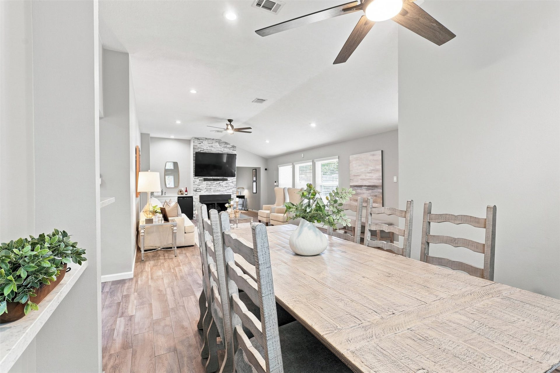 Spacious dining area flows seamlessly into the living room, creating an open-concept layout ideal for everyday living and entertaining.