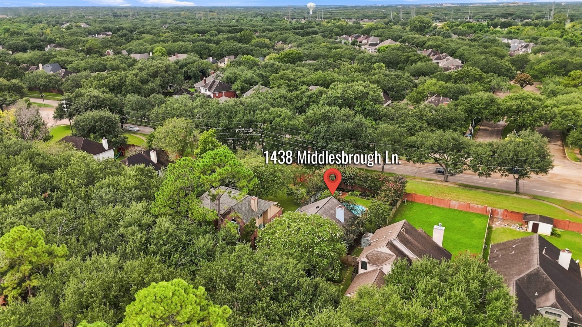 Nestled in a lush, tree-lined neighborhood, this charming home offers privacy and tranquility, with convenient access to nearby roads and amenities.
