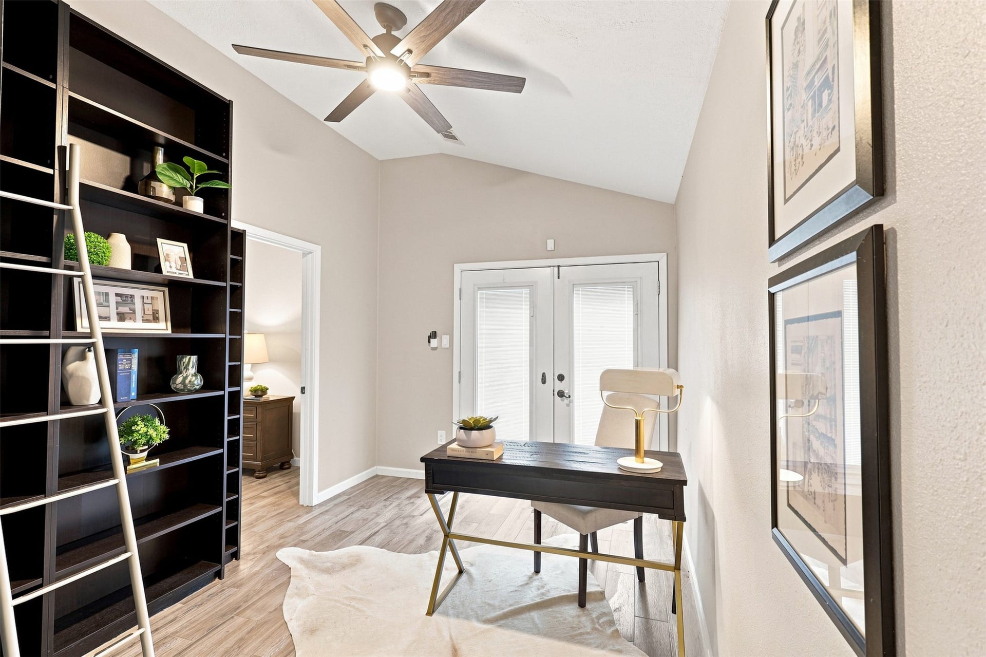 Versatile space with vaulted ceiling and direct outdoor access offers an ideal setting for a home office, study, or quiet retreat.