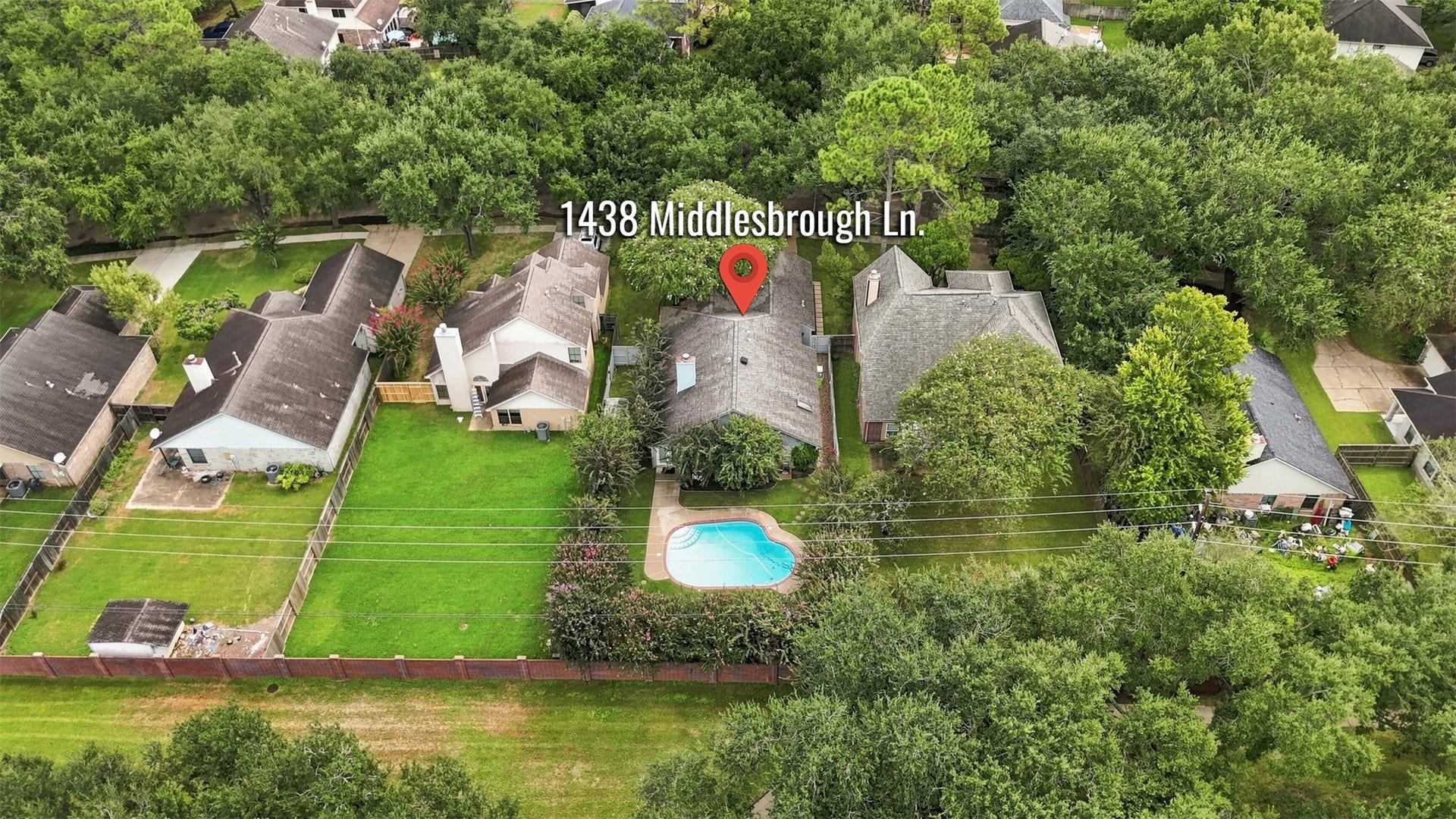 Charming home on a spacious lot, featuring a private backyard oasis with a sparkling pool, surrounded by lush greenery for ultimate privacy.
