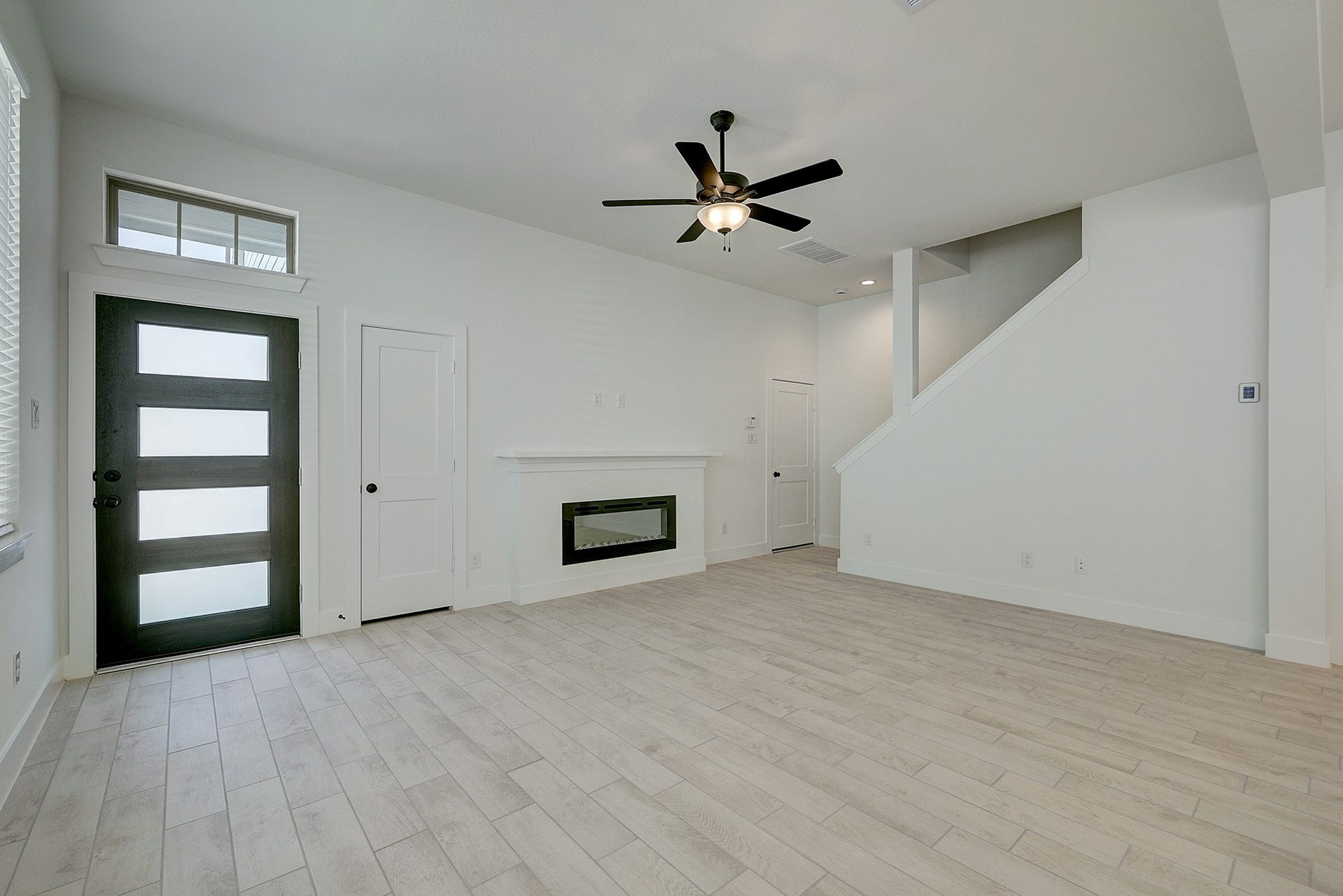 Spacious family room with modern fireplace.