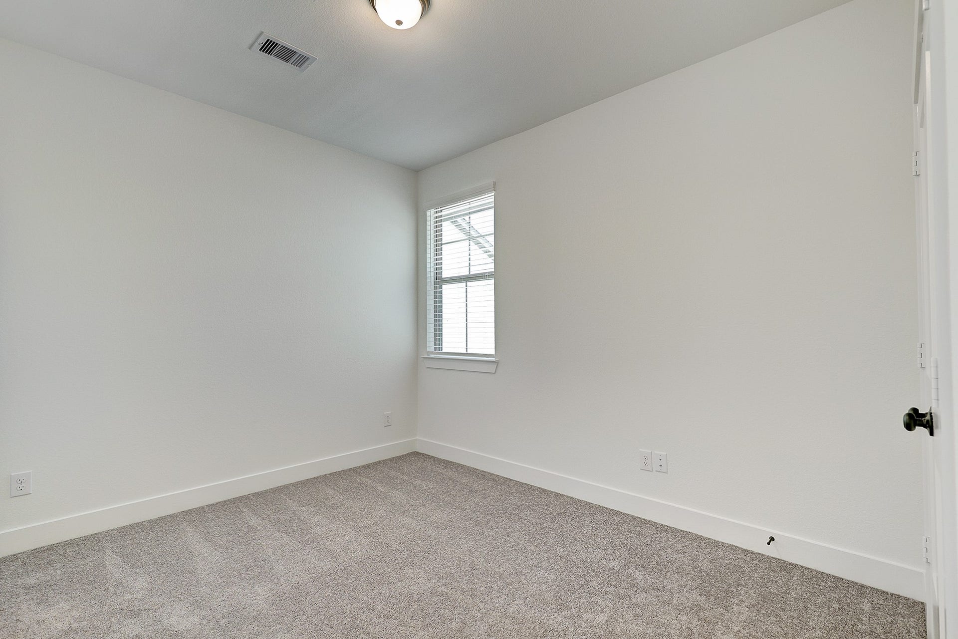 Additional upstairs bedroom offers flexible living space.