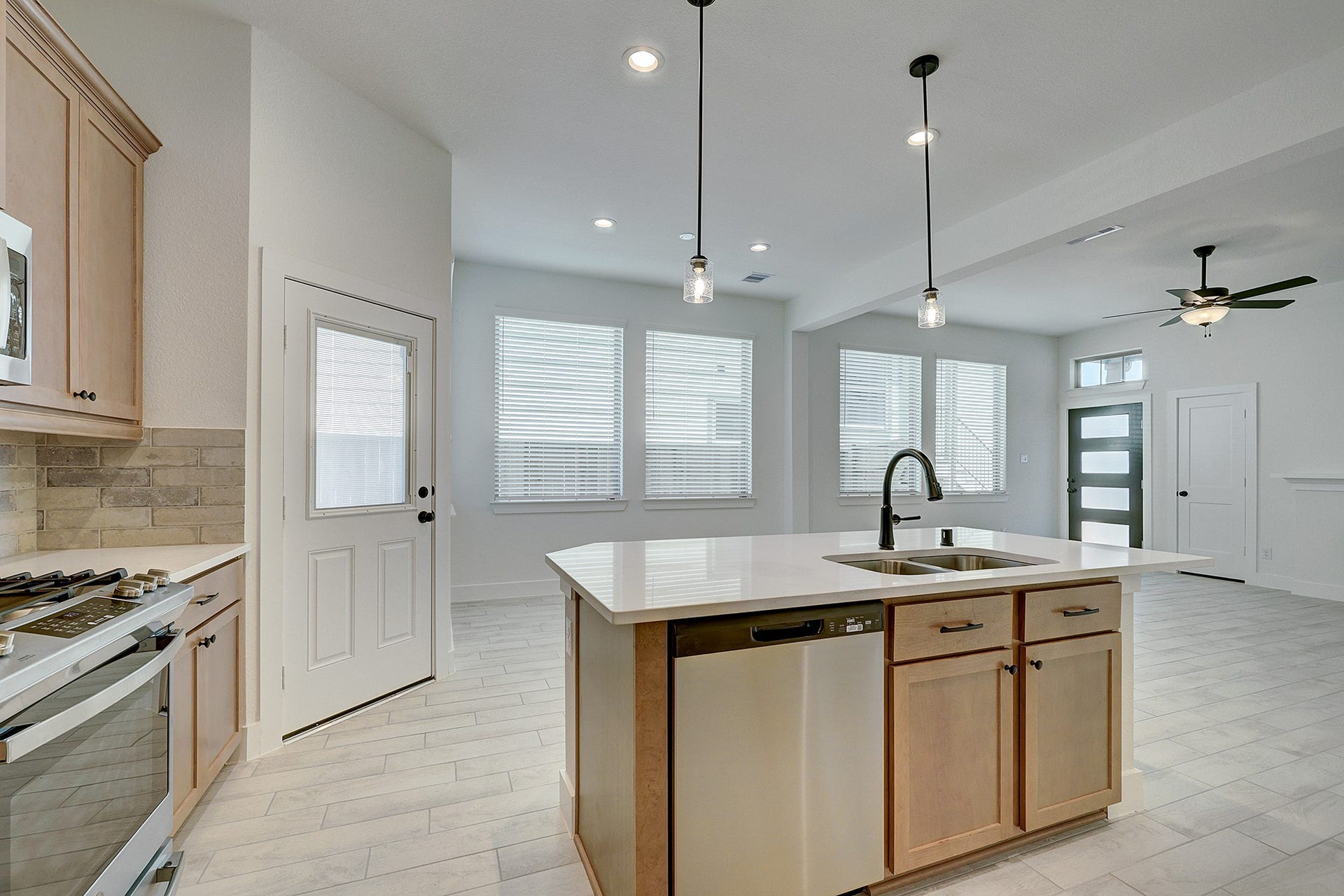 Quartz island overlooks the bright, open living space.