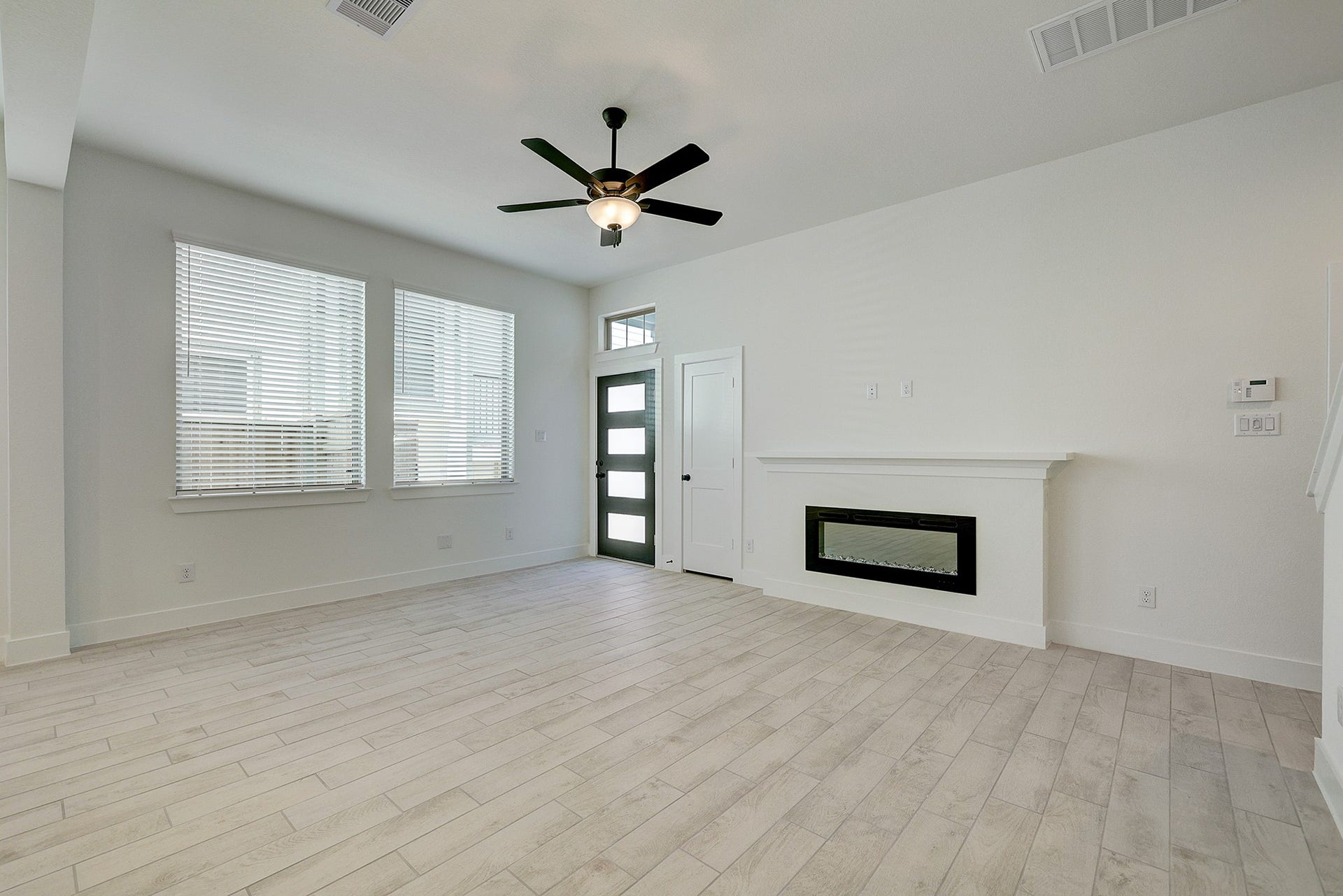 Light-filled living area with clean, modern finishes.