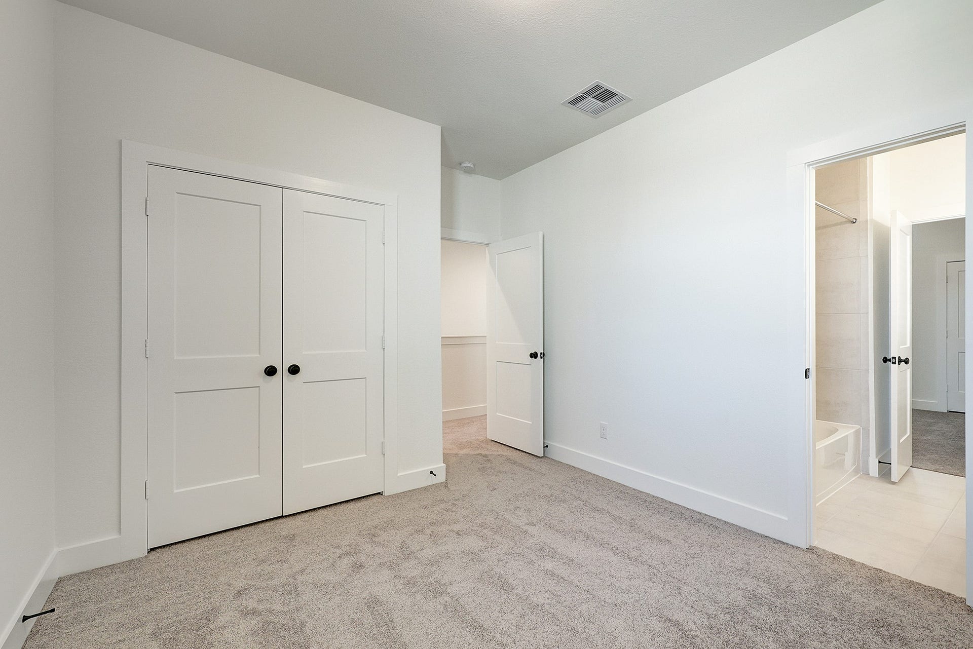 Spacious bedroom with convenient access to adjoining bathroom shared with bedroom 3/