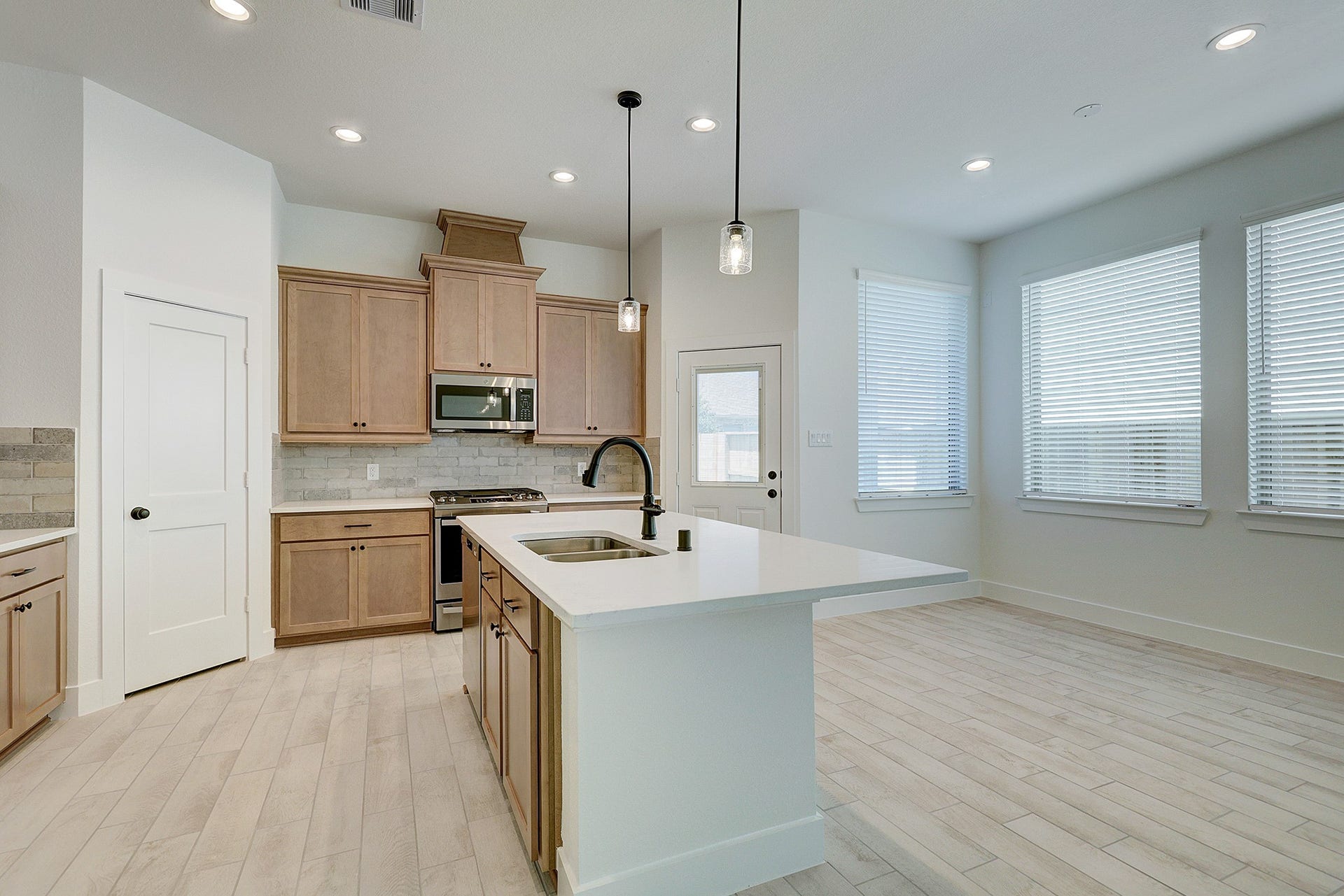 Bright kitchen with generous prep and gathering space.