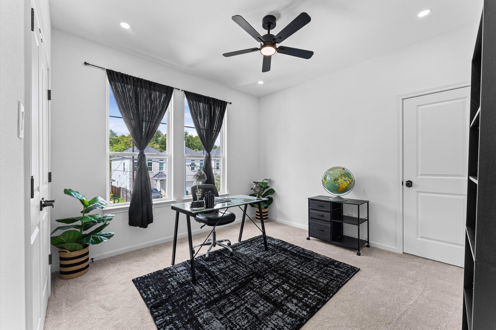 8132 Sunnyhill Street, Houston, TX 77088 Third Bedroom / Home Office: A versatile third bedroom, beautifully suited for a private home office, study, or guest retreat. A flexible space designed to complement your lifestyle, whether working from home, pursuing hobbies, or welcoming guests.