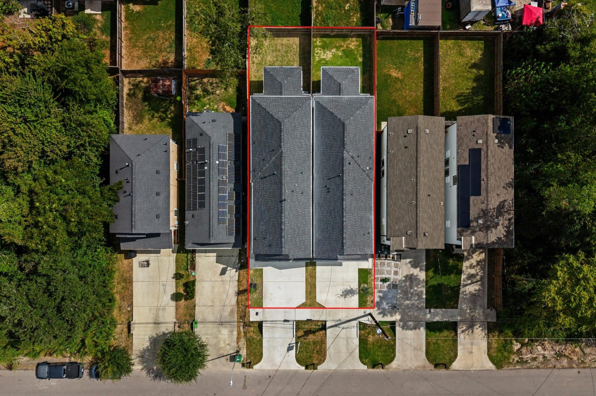 8132 Sunnyhill Street, Houston, TX 77088 Property & Backyard: An elevated view highlighting the home's layout, privately fenced backyard, and outdoor patio space, perfect for relaxing or entertaining.