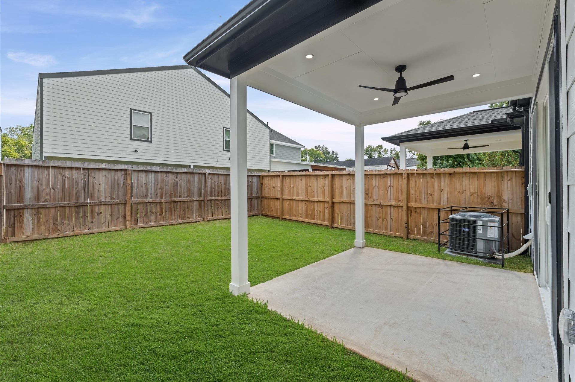 8132 Sunnyhill Street, Houston, TX 77088 Photo 1 Covered Patio (Close-Up): Step outside to your inviting covered patio, complete with recessed lighting and a ceiling fan for added comfort. The perfect setting for morning coffee, weekend grilling, or relaxing evenings overlooking your privately fenced backyard.