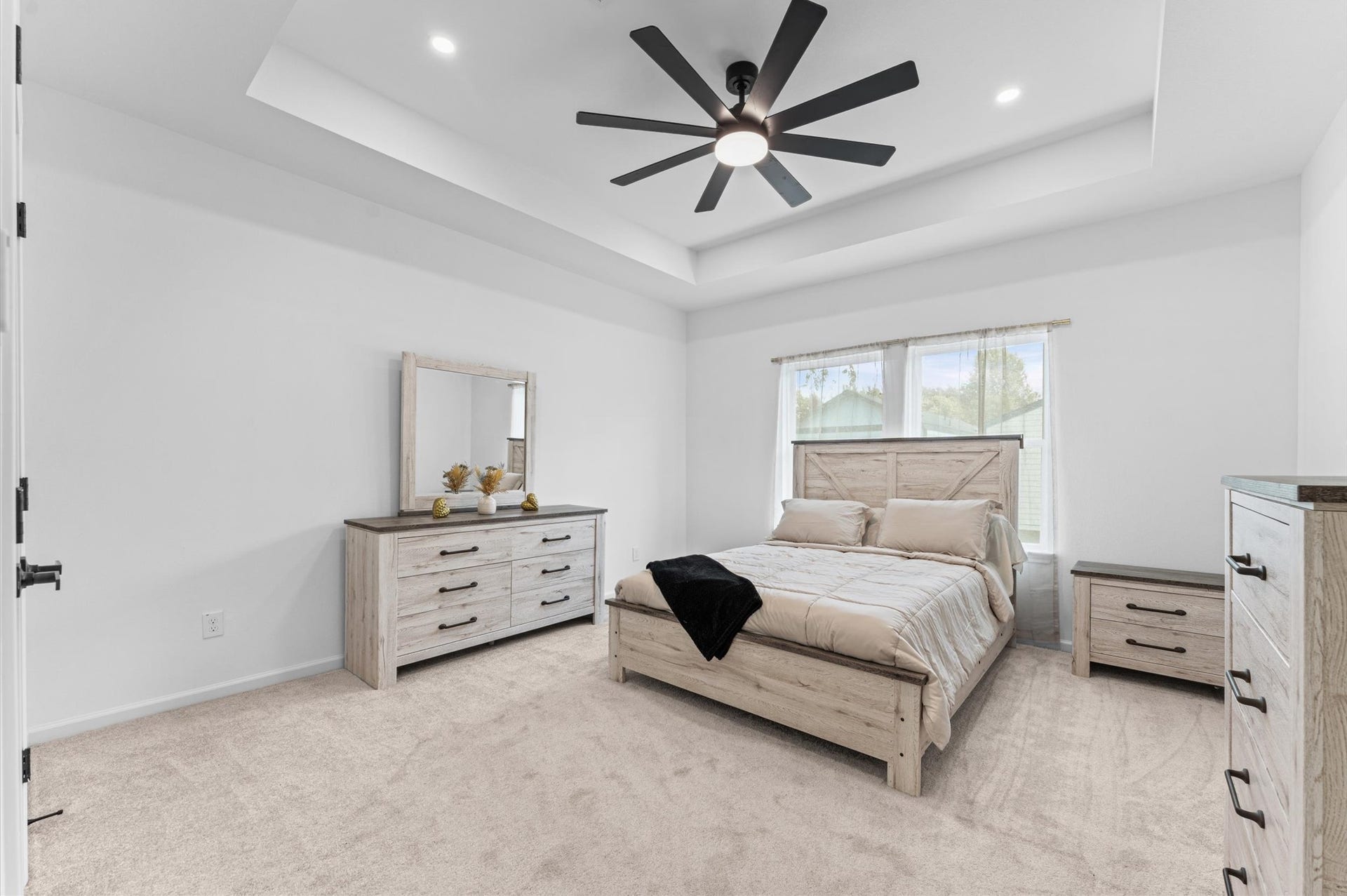 8132 Sunnyhill Street, Houston, TX 77088 Primary Bedroom: A peaceful primary retreat thoughtfully designed for comfort and relaxation, offering a beautiful space to unwind at the end of the day.
