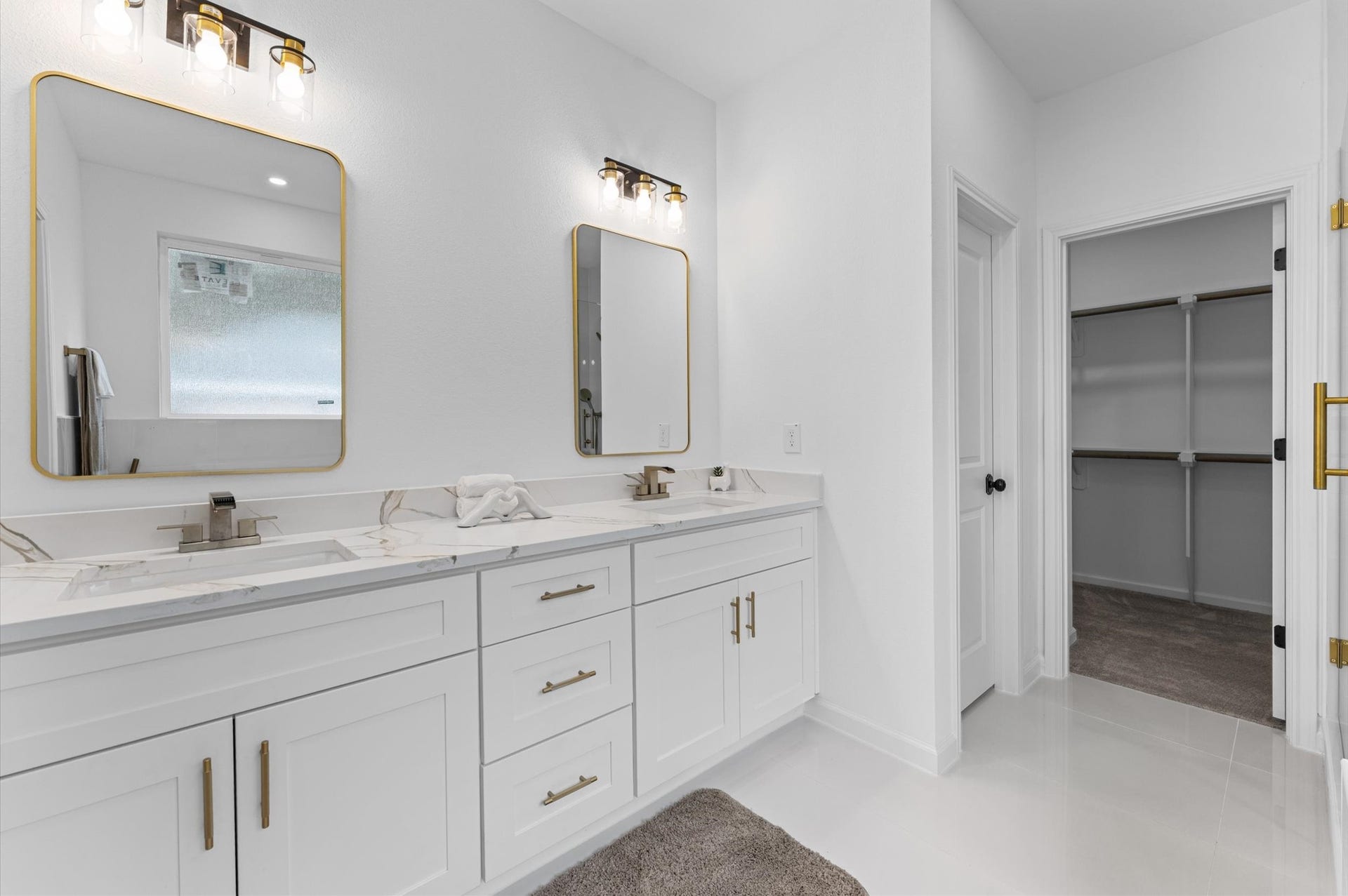8132 Sunnyhill Street, Houston, TX 77088 Primary Bath Double Vanities: Sophisticated style meets everyday functionality with beautiful quartz countertops, dual vanities, and elegant modern finishes in this thoughtfully designed primary bathroom.