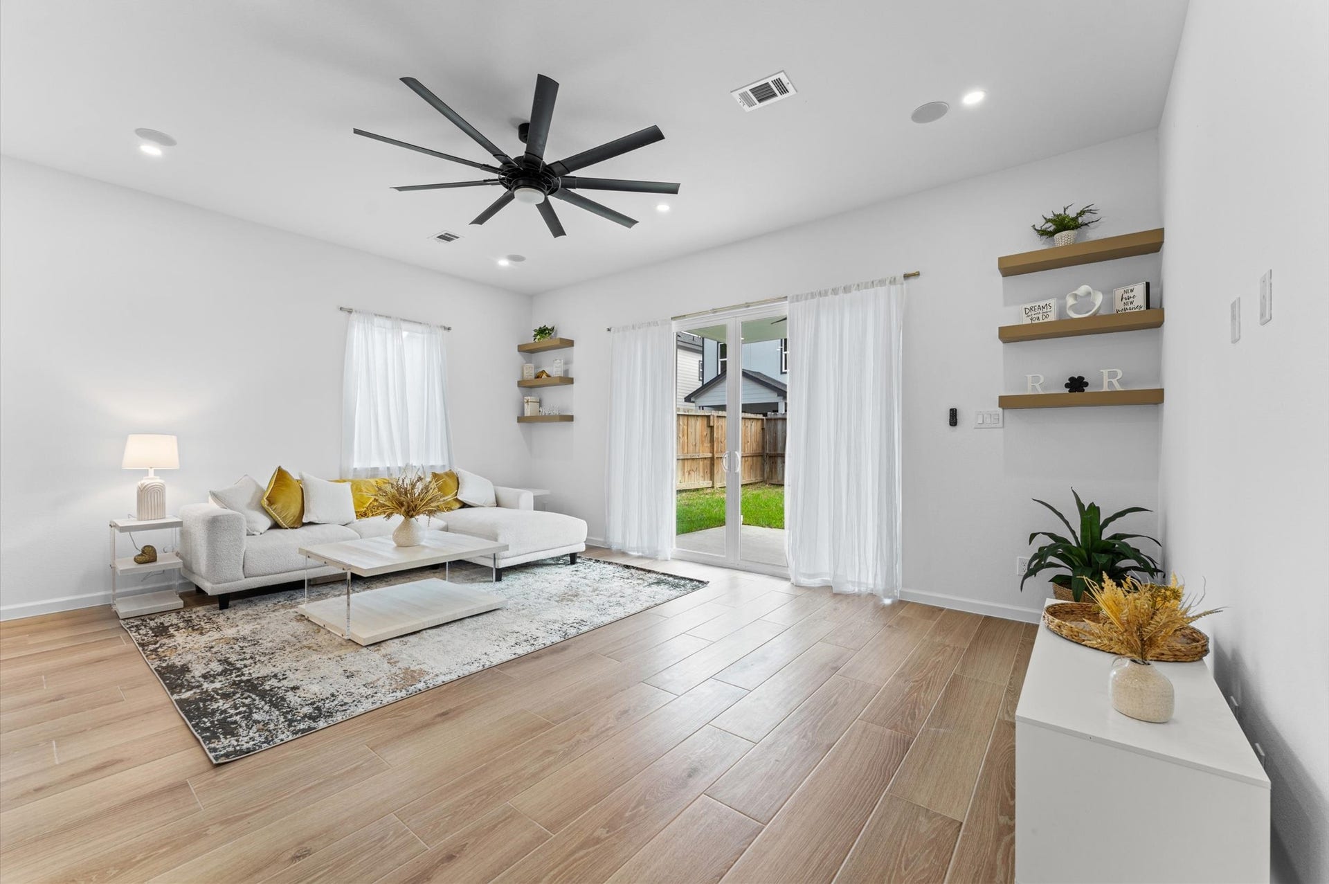 8132 Sunnyhill Street, Houston, TX 77088 Living Room & Backyard Views
Welcome to the heart of the home! This beautifully designed living room offers an inviting space for relaxation and entertaining, highlighted by expansive double glass doors overlooking your privately fenced backyard. Natural light and seamless indoor-outdoor flow create the perfect atmosphere for everyday living.