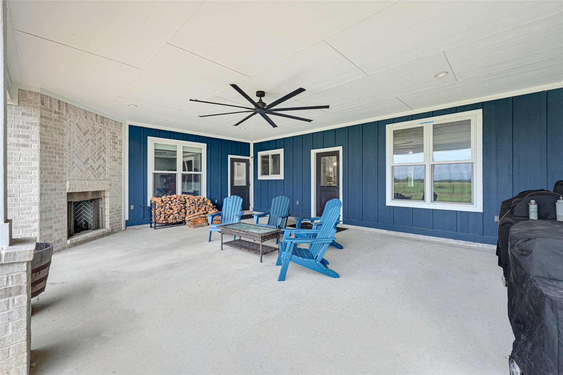 3325 County Road 160, Alvin, TX 77511 Oversized patio with ceiling fan and wood burning fireplace