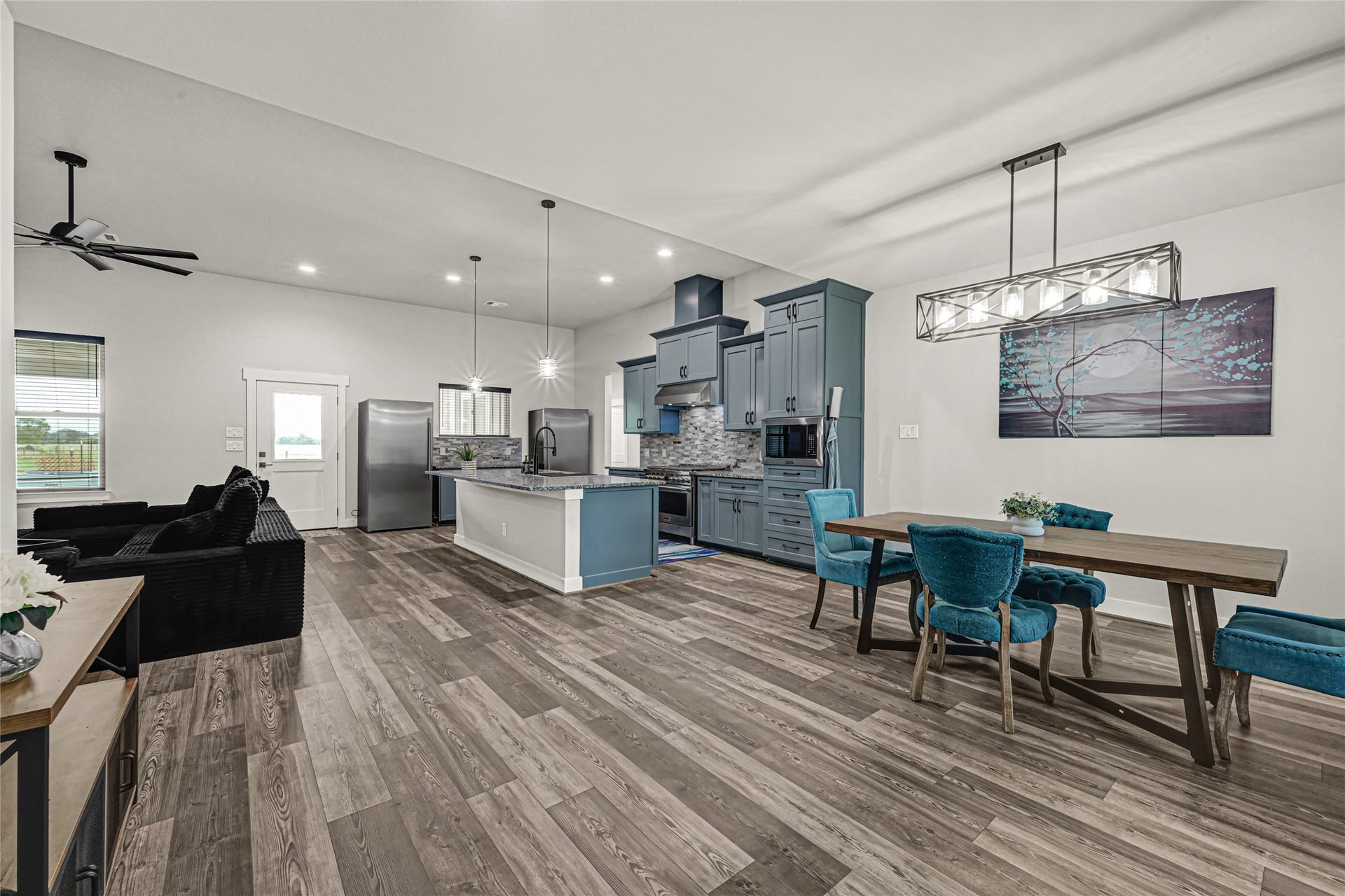 3325 County Road 160, Alvin, TX 77511 Open concept, with kitchen open to living room and dining room