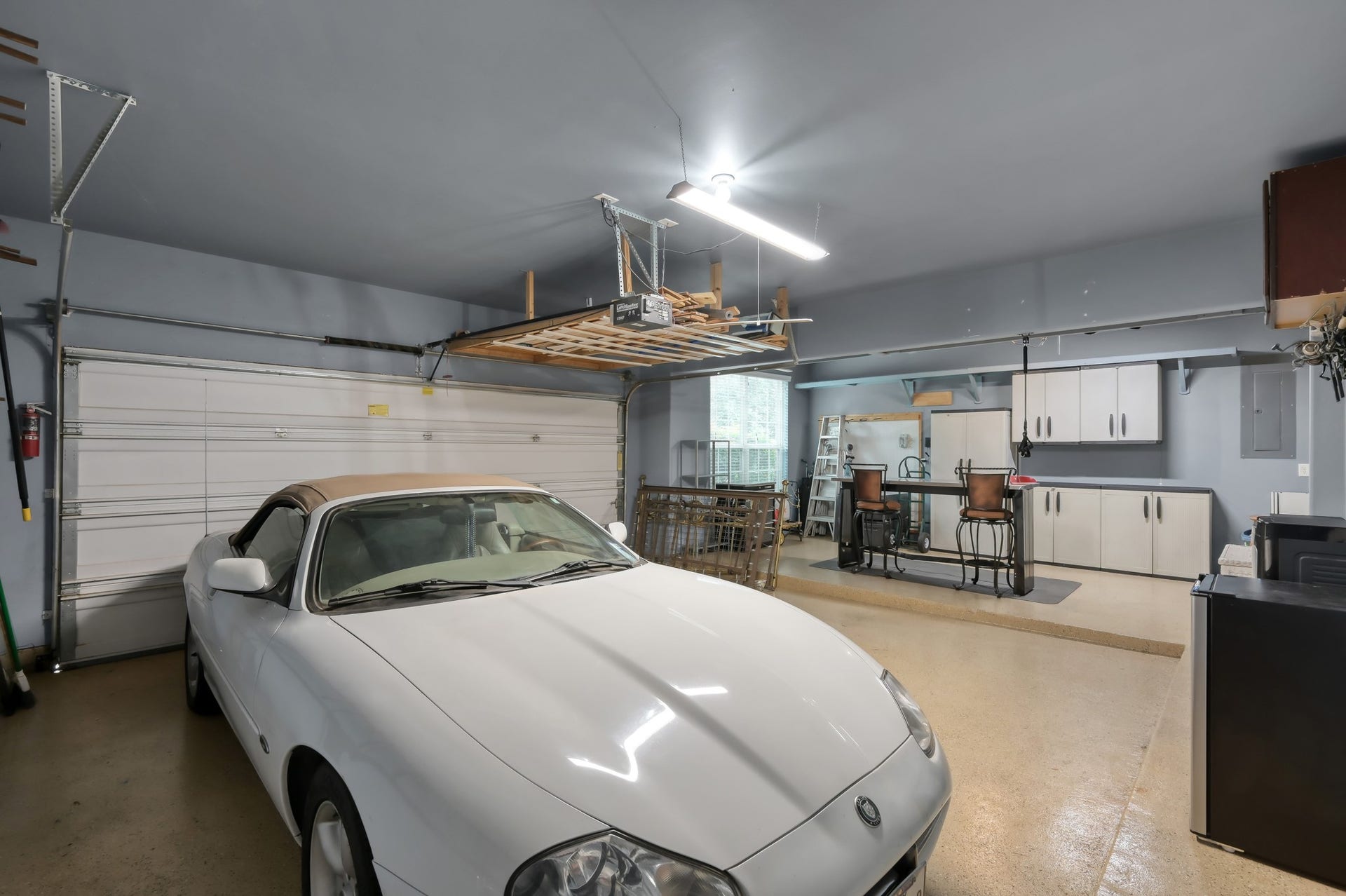 2502 Wynden Meadow Lane, Conroe, TX 77304 Oversized garage setup with epoxy-style flooring, built-in cabinetry, workshop space, hanging storage, and room for your toys, tools, and projects. A rare bonus area thats both functional and organized, with extra space for entertaining or hobbies. It is also possible to put in a garage door and using the space for a extra vehicle!