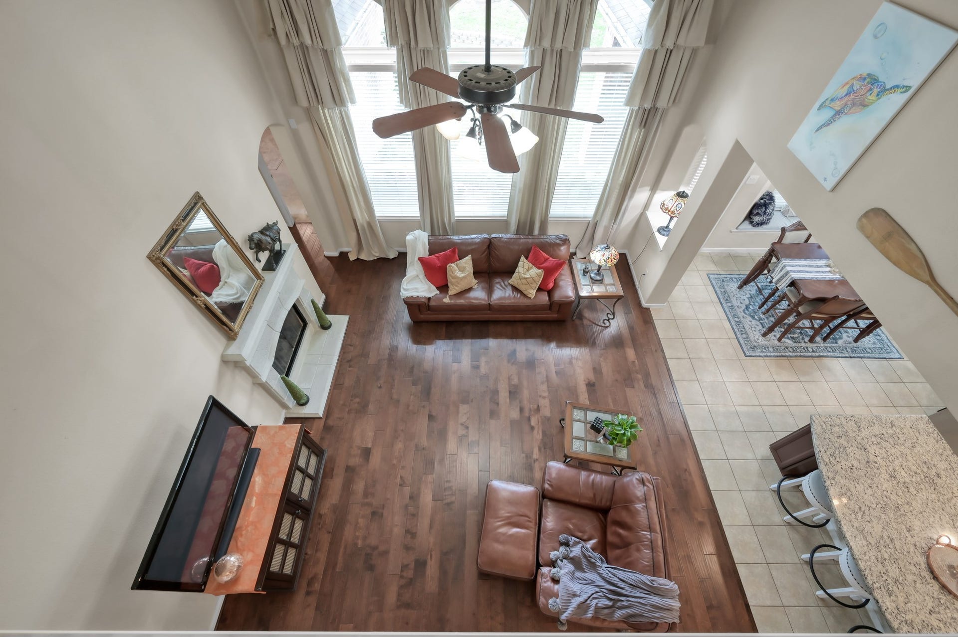 2502 Wynden Meadow Lane, Conroe, TX 77304 An impressive overlook from the second floor showcases the homes open layout, soaring ceilings, and abundance of natural light. The perfect design for both entertaining and comfortable everyday living.