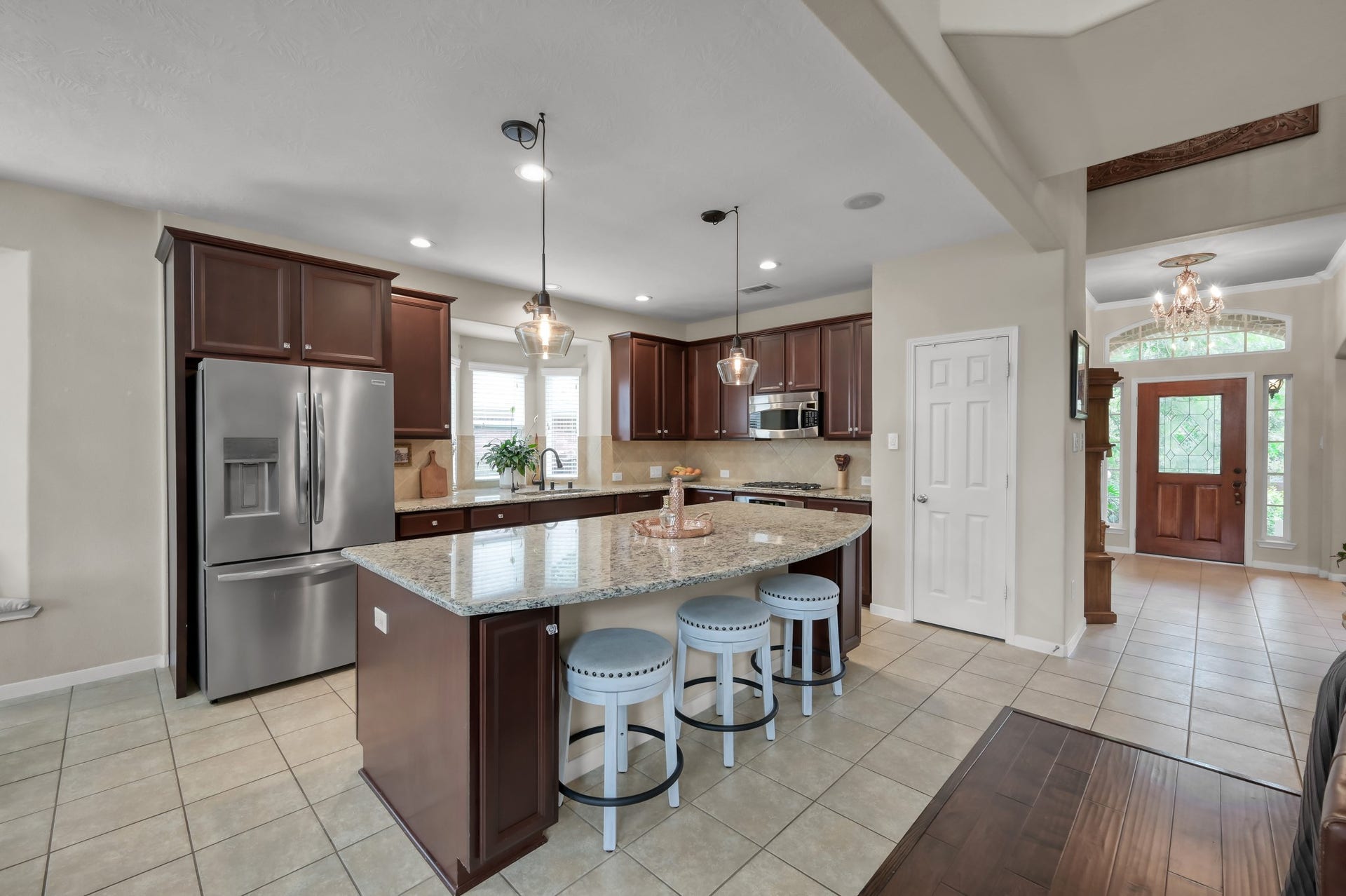 2502 Wynden Meadow Lane, Conroe, TX 77304 The open-concept design flows seamlessly from the kitchen into the main living areas and entryway, creating an airy feel with great sightlines throughout the home.