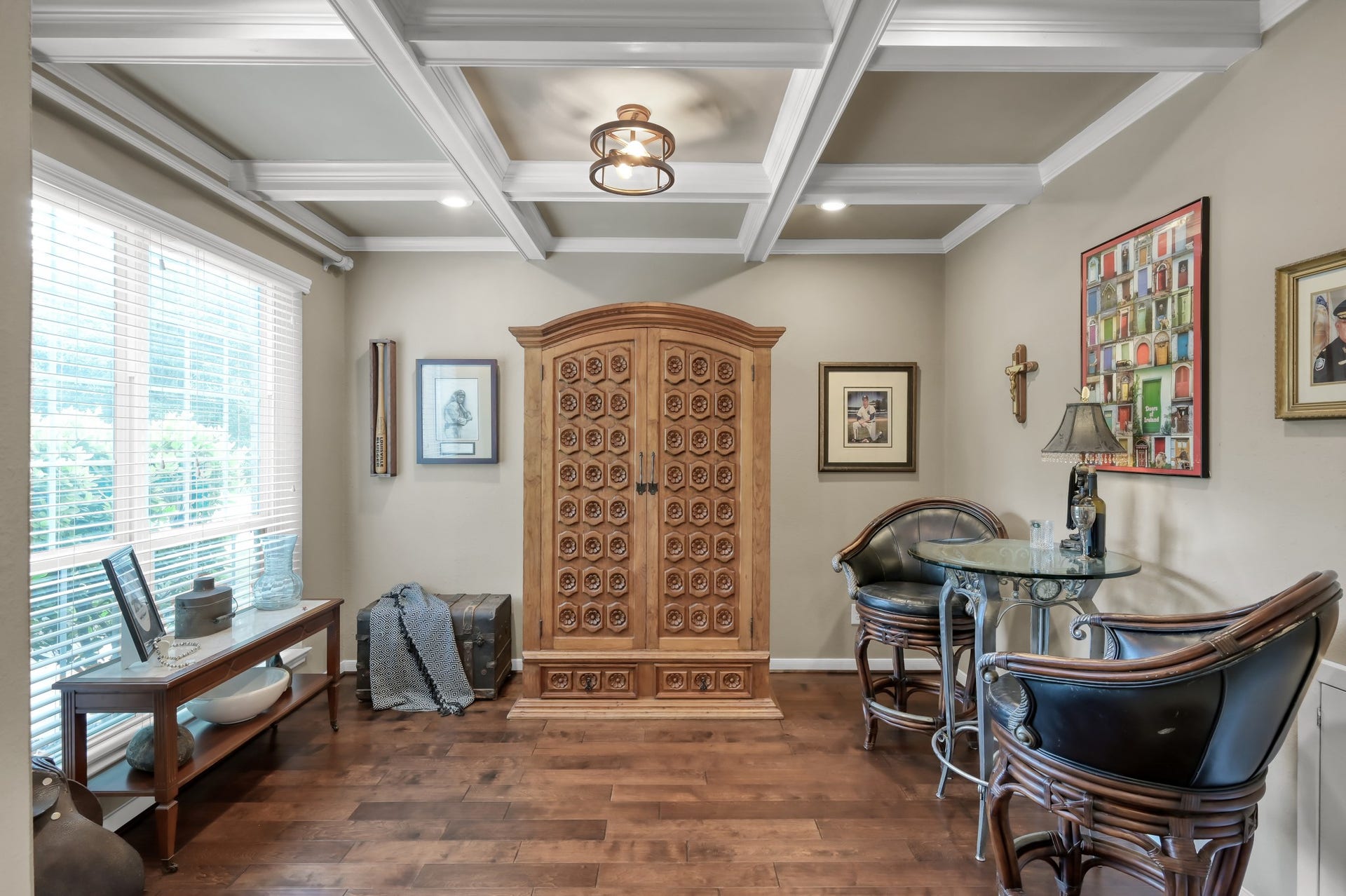 2502 Wynden Meadow Lane, Conroe, TX 77304 This beautiful formal dining room combines warmth and elegance with custom ceiling details, rich flooring, and large windows that bring in plenty of natural light.
