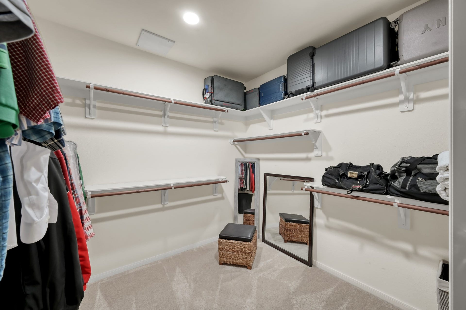 2502 Wynden Meadow Lane, Conroe, TX 77304 Large walk-in closet with abundant hanging space, upper storage shelves, and room to keep everything neatly organized.