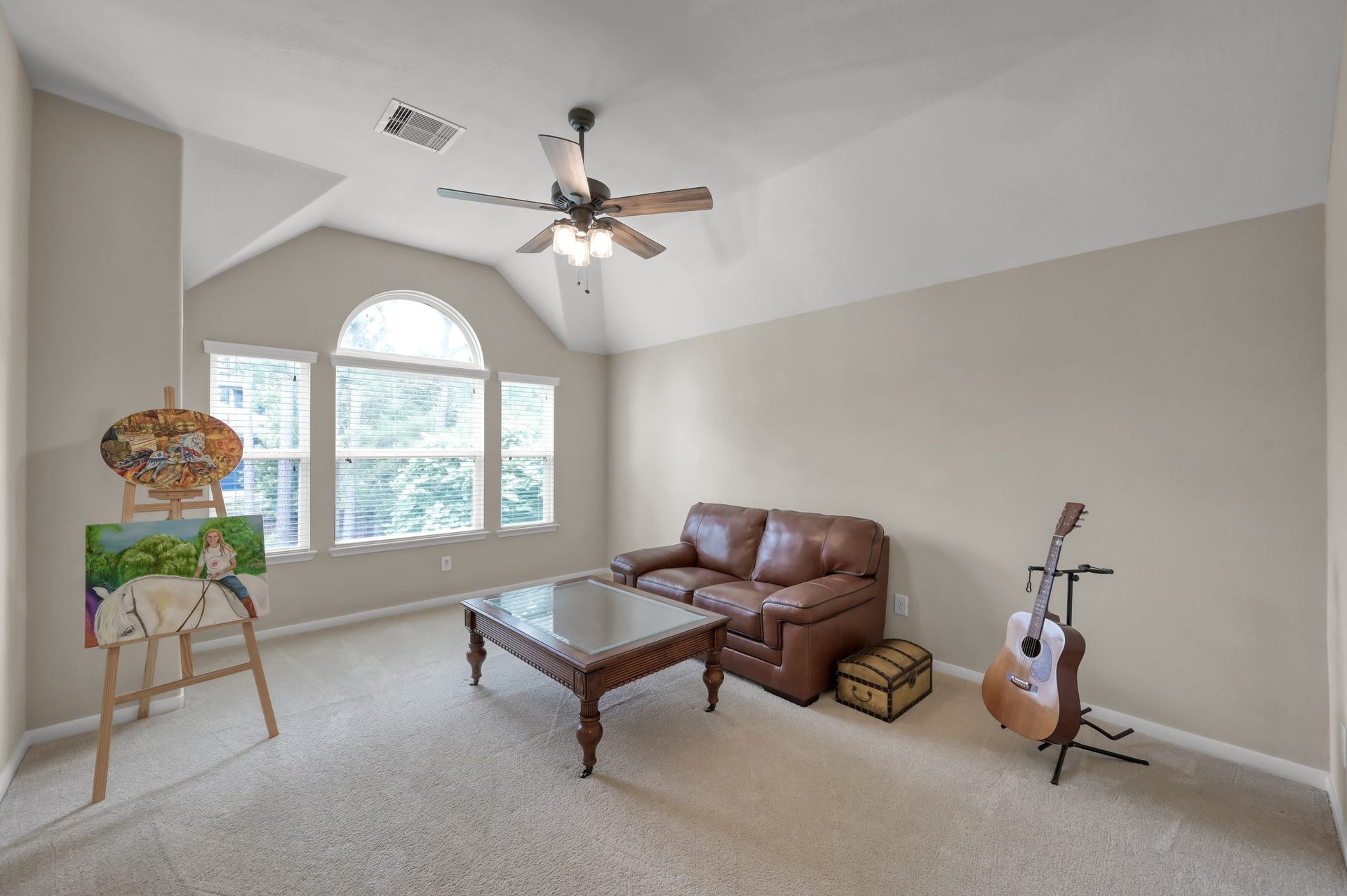 2502 Wynden Meadow Lane, Conroe, TX 77304 Bright and open secondary living space or game room with oversized windows and endless possibilities for relaxing, entertaining, hobbies, or creating your own personal retreat.