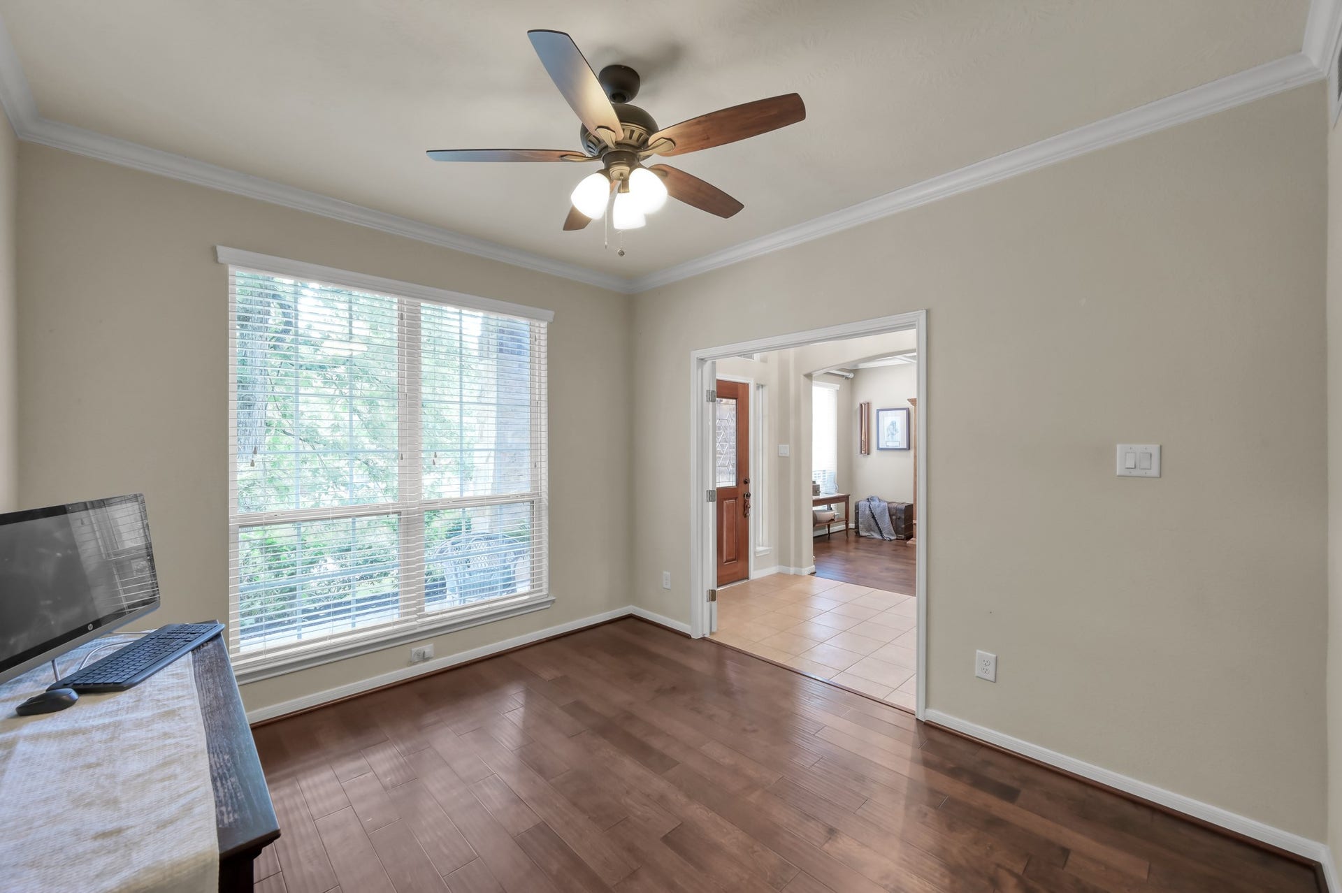 2502 Wynden Meadow Lane, Conroe, TX 77304 The Study offers warm wood floors and neutral tones create a comfortable, move-in ready space that can easily adapt to your lifestyle needs.