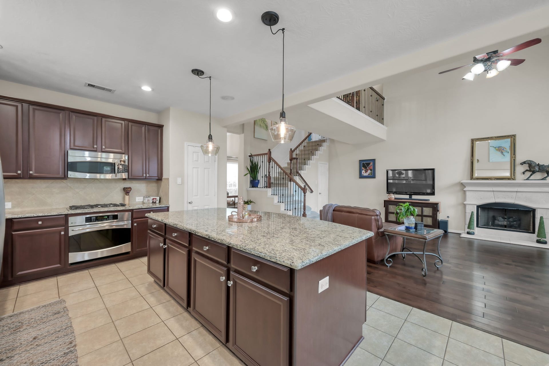 2502 Wynden Meadow Lane, Conroe, TX 77304 This spacious kitchen overlooks the family room, making it perfect for entertaining or staying connected while cooking. The oversized island, pendant lighting, and open layout create a bright and welcoming gathering space.