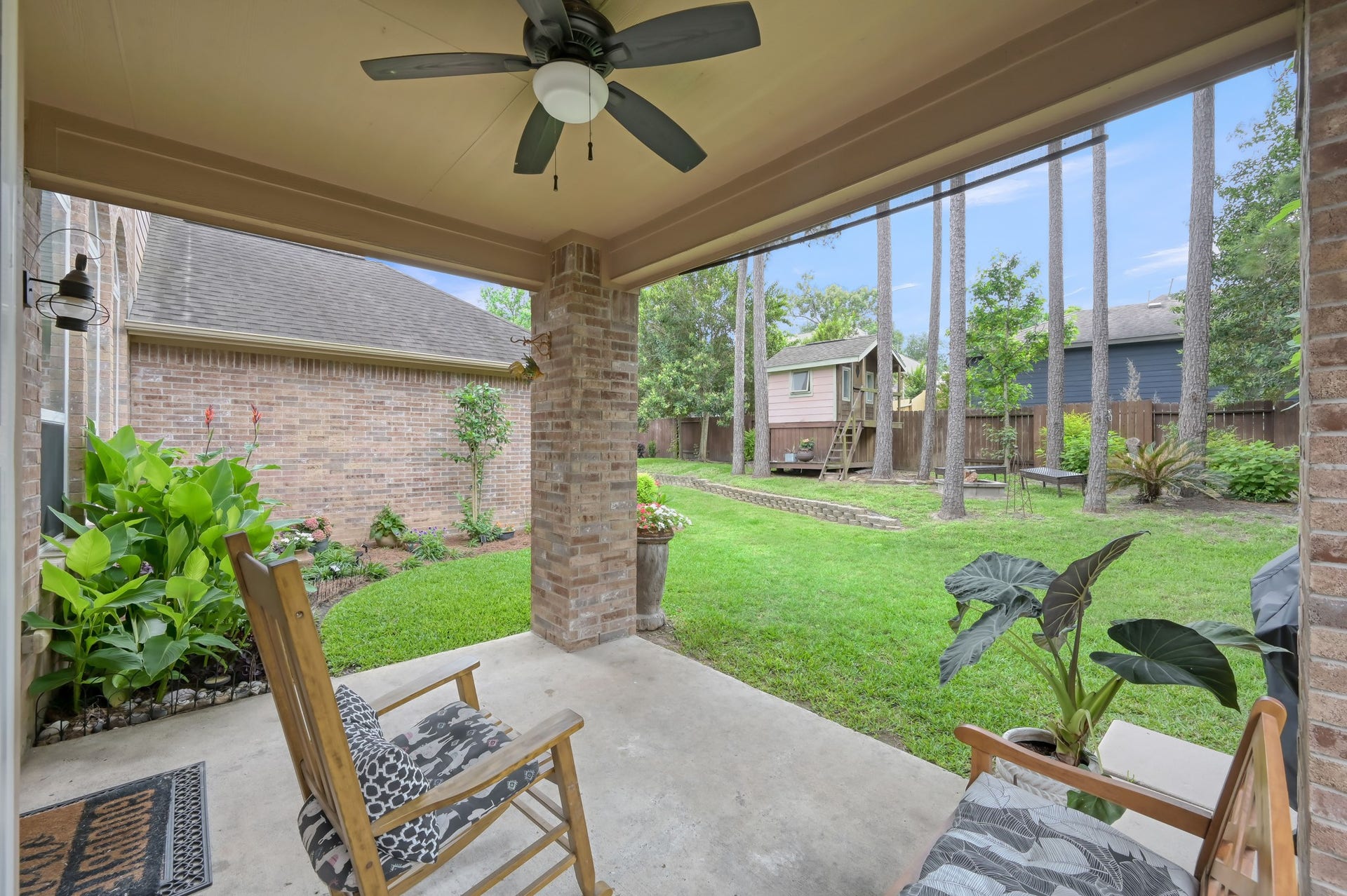 2502 Wynden Meadow Lane, Conroe, TX 77304 Relax and unwind on the covered back patio overlooking a lush backyard filled with towering trees and plenty of green space. Whether youre enjoying your morning coffee or hosting friends, this backyard feels private, peaceful, and inviting.