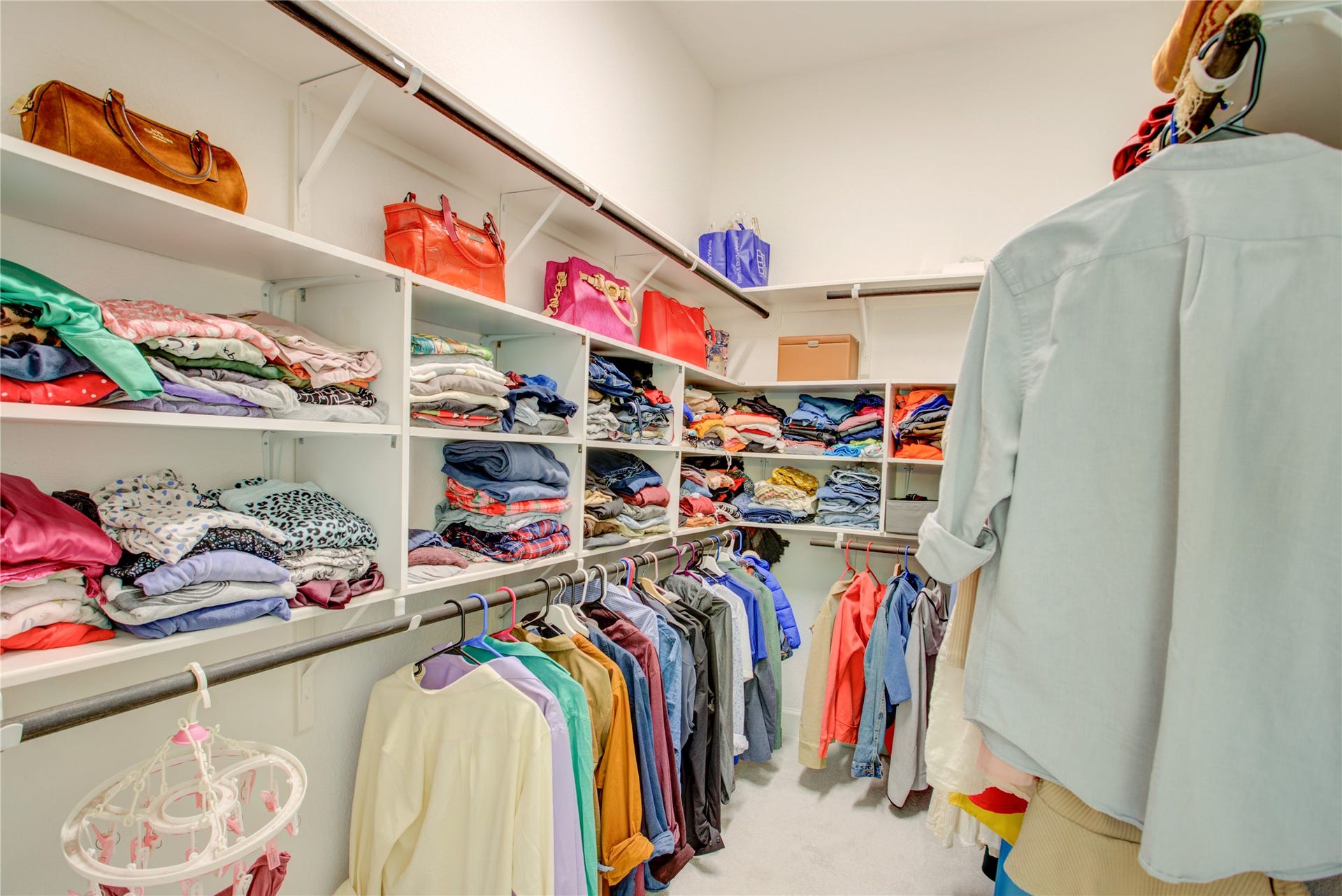 3423 Tranquil Harvest Trail, Richmond, TX 77406 Spacious walk-in closet with extensive built-in shelving, and abundant storage space.
