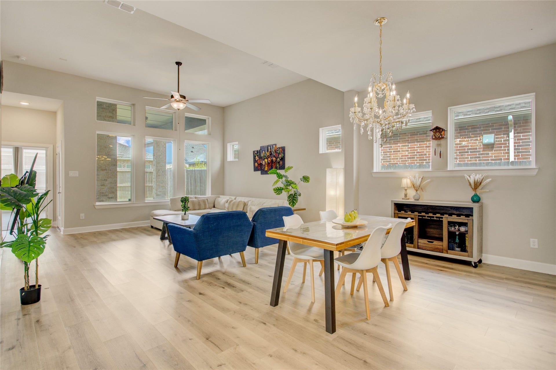 3423 Tranquil Harvest Trail, Richmond, TX 77406 Open-concept dining and living area a spacious layout with the dining area positioned between the kitchen and living room.