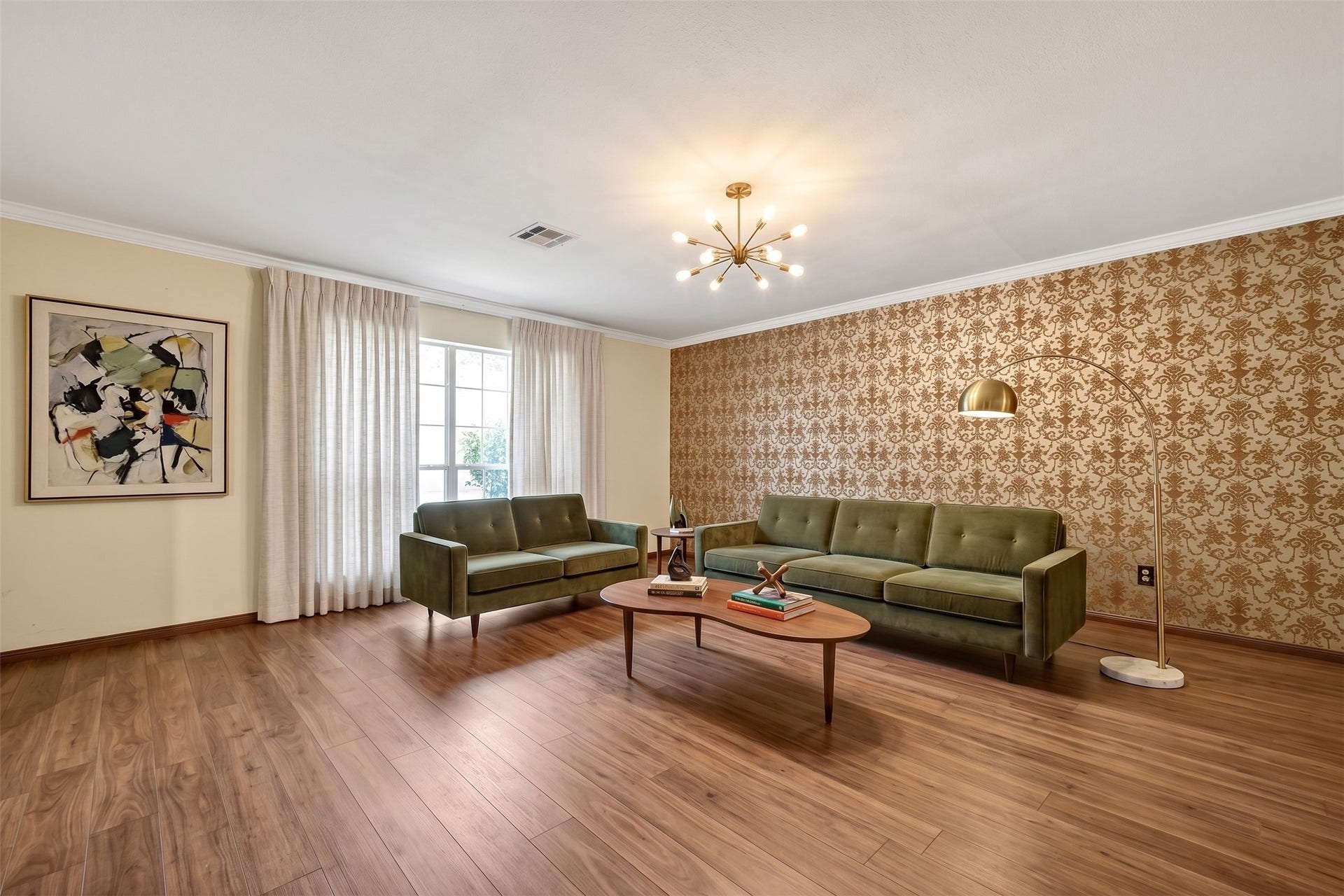 Living the original wallpaper, changing out the floors, lighting and window covering, gives you an amazing inviting formal living area. Virtual enhanced