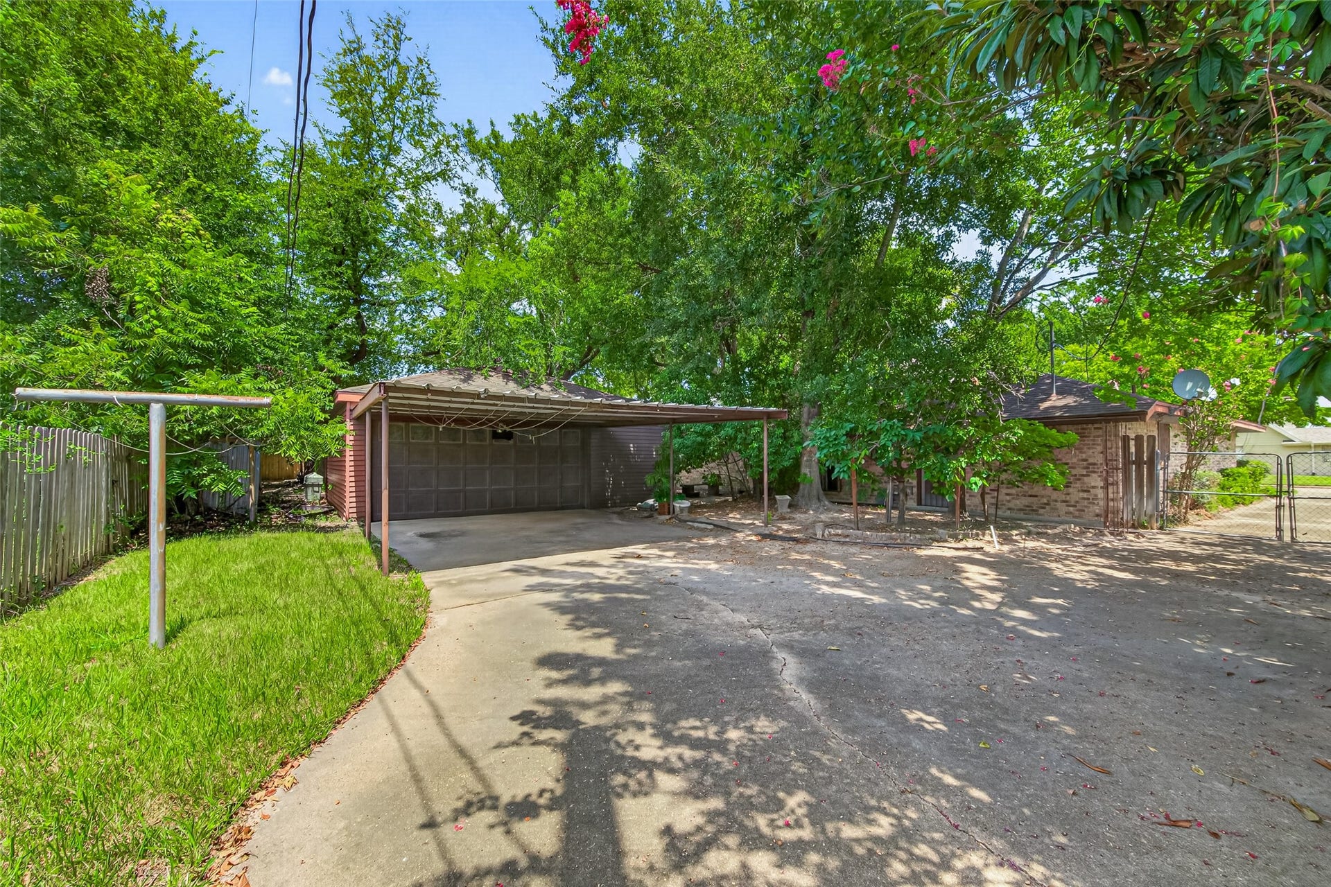 Backyard has so much potential. Two car garage and a carport along with a covered porchh area.
