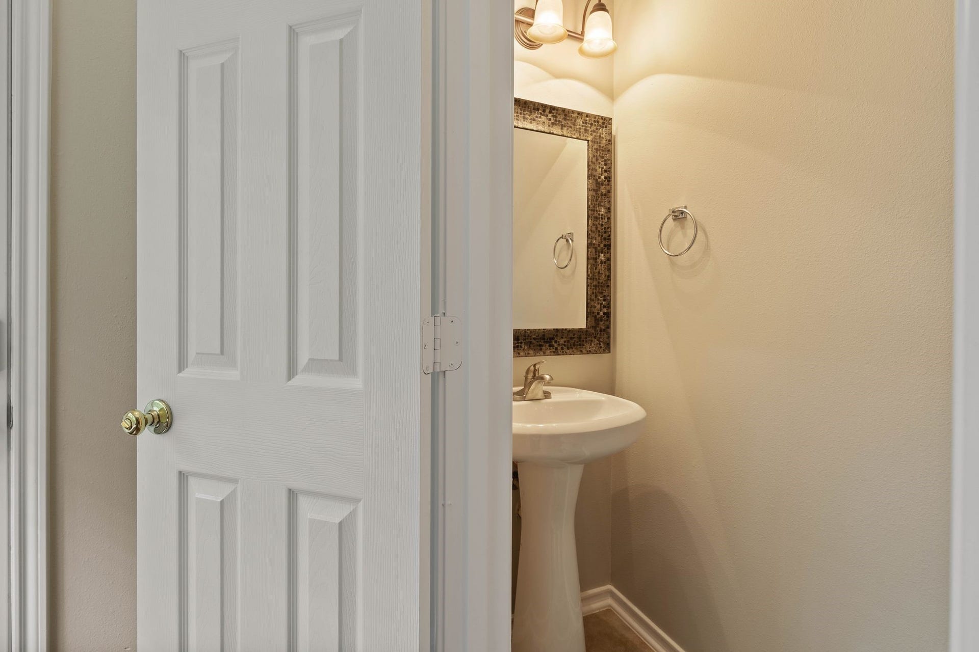 50 Leafstalk Court, The Woodlands, TX 77382 downstairs powder room convenient for guests