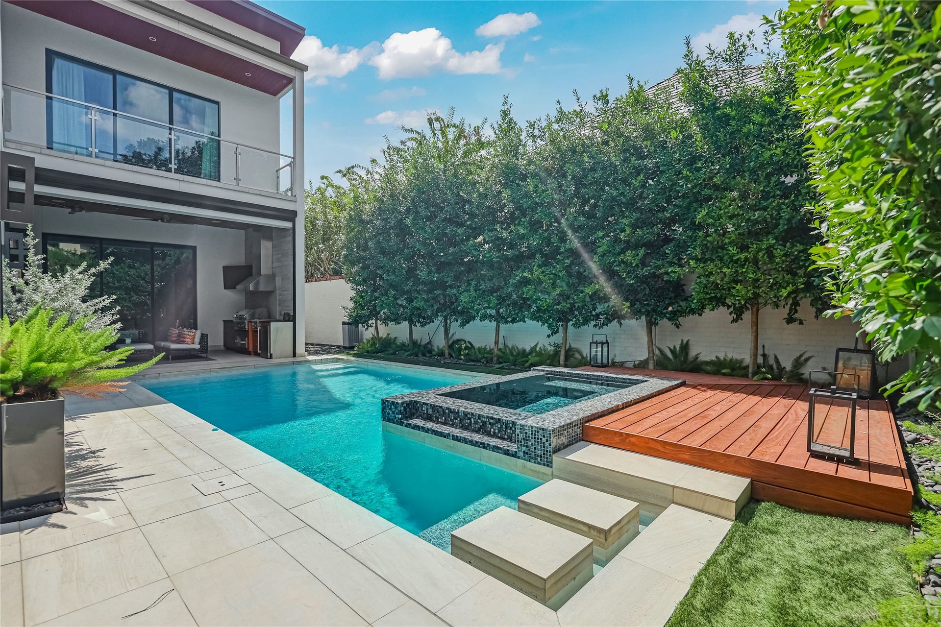 2608 Barbara Lane, Houston, TX 77005 Tall evergreens line the perimeter of this backyard oasis offering privacy, shade, and quiet vitality to this private space.