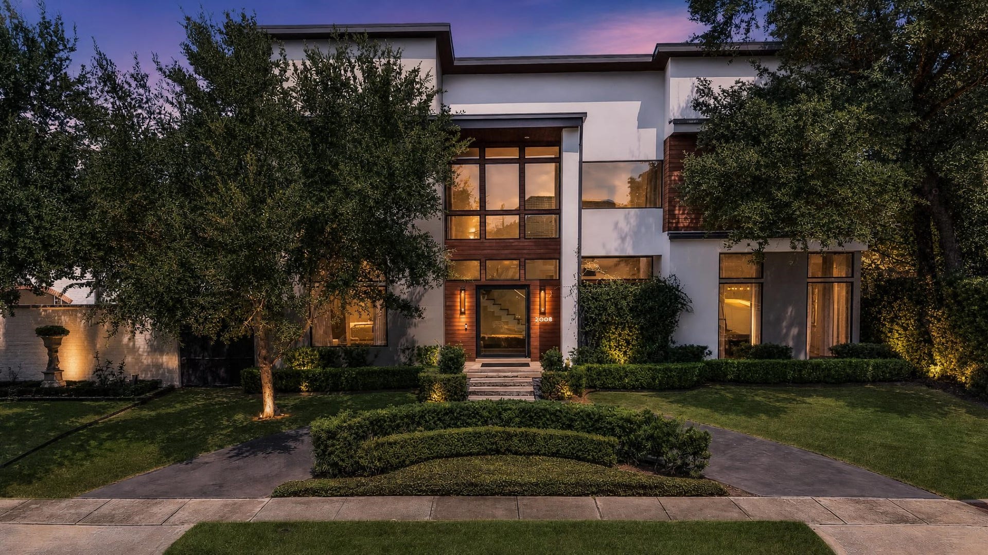 2608 Barbara Lane, Houston, TX 77005 Welcome to 2608 Barbara Lane. Custom-built and lovingly held by one family since its completion, this exceptional residence is now being offered to the next family. Upon arrival, you're greeted by modern architecture framed by mature trees with a two-story glass entry, warm wood accents and a manicured circular drive. (Staged picture).