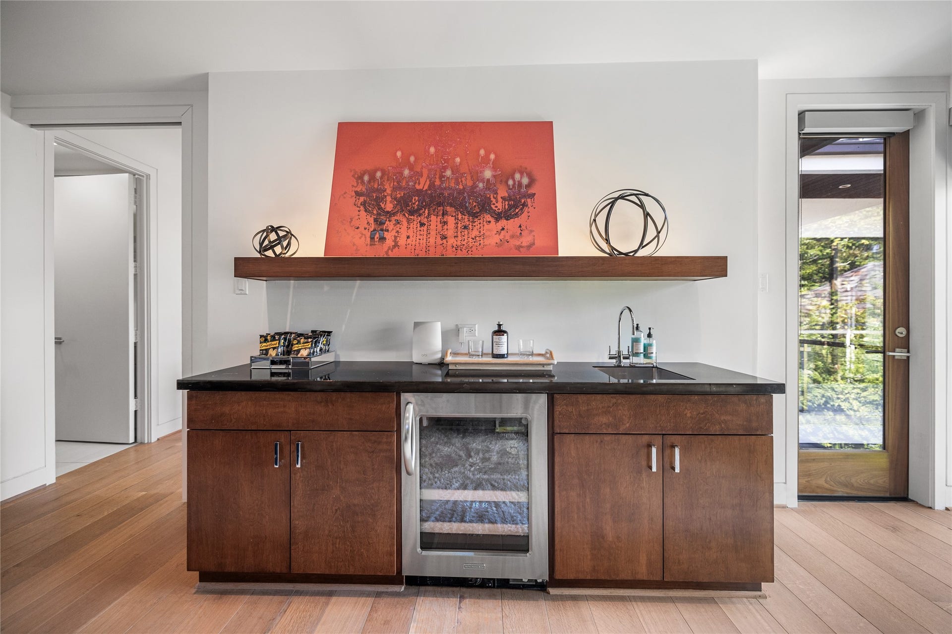 2608 Barbara Lane, Houston, TX 77005 This media room also features a beverage fridge with a sink, custom shelving and generous storage, plus a door opening to a private balcony overlooking the pool for seamless indoor-outdoor enjoyment.