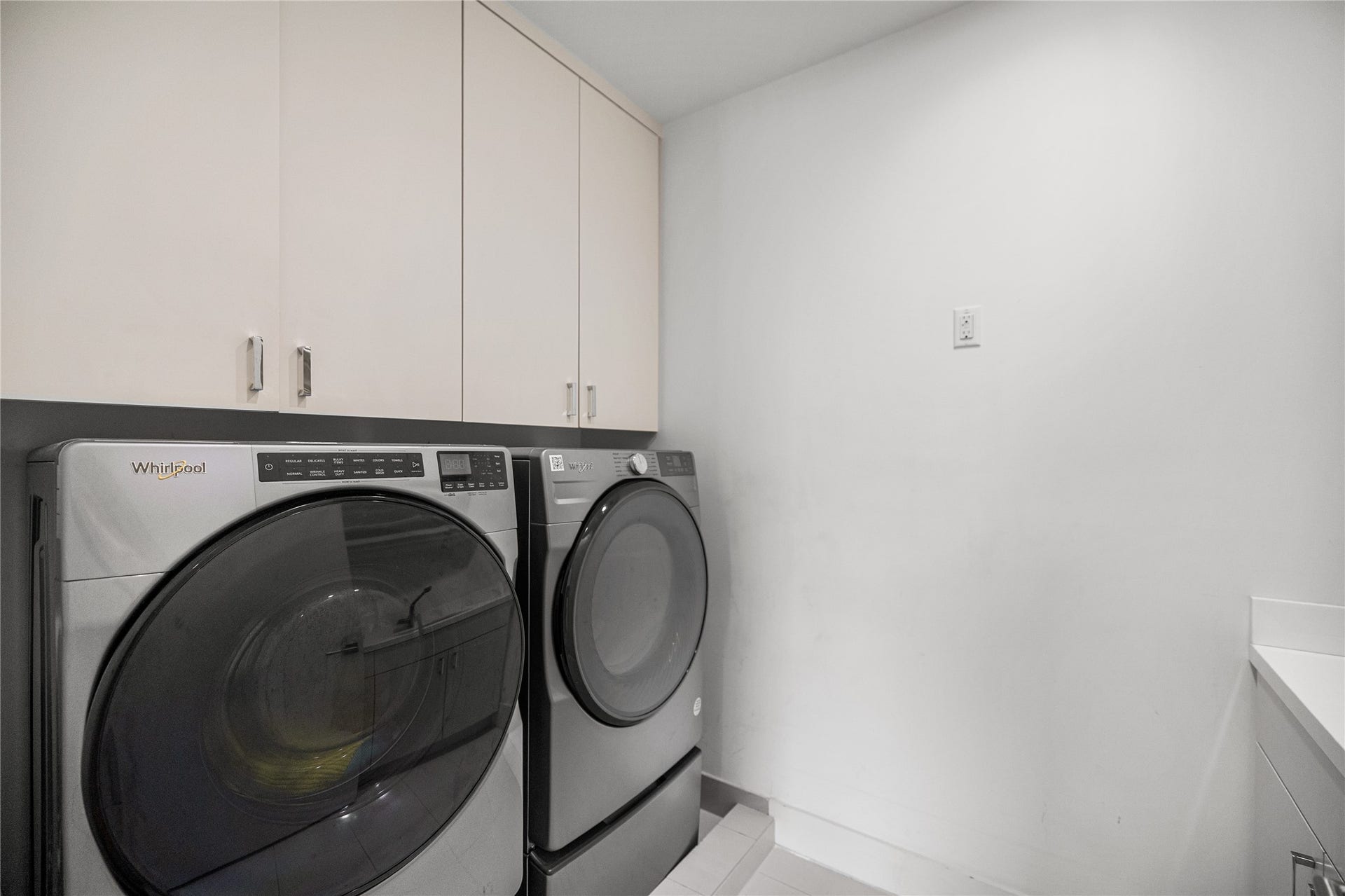 2608 Barbara Lane, Houston, TX 77005 A well-designed second-floor utility room features a built-in sink and cabinetry for streamlined storage and everyday convenience.