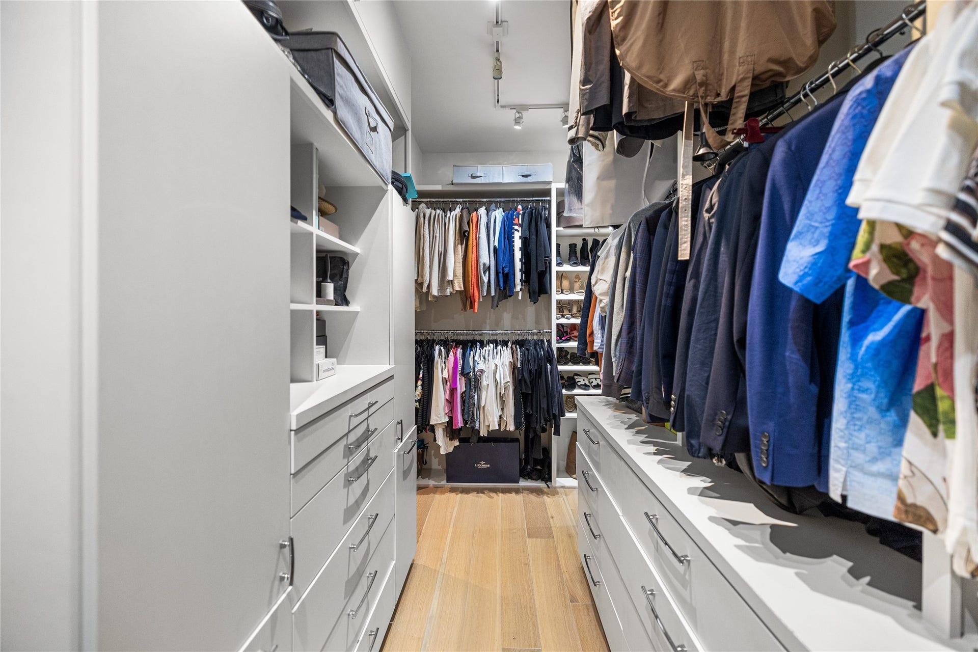 2608 Barbara Lane, Houston, TX 77005 Wrapping gracefully from one side to the other, the primary closet unfolds with custom built-ins and generous hanging space. Every garment, accessory, and pair of shoes finds its place in this expansive closet.