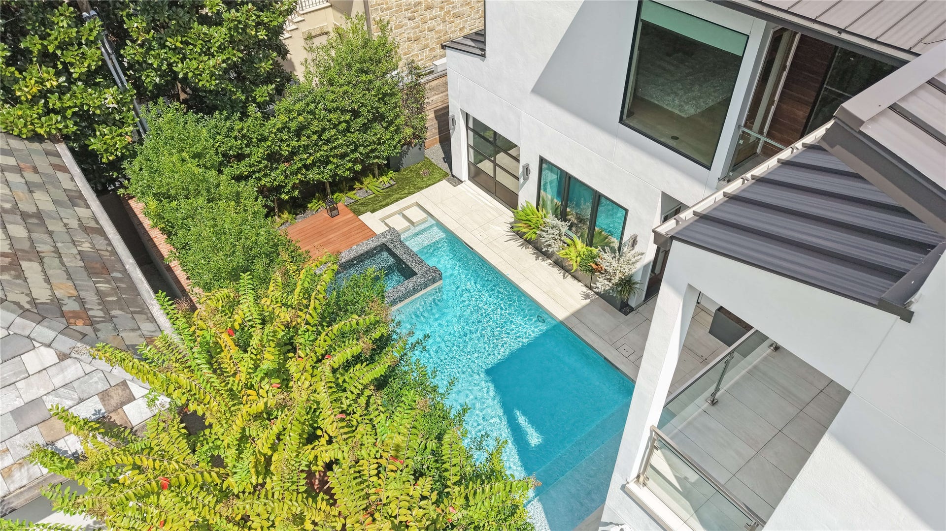 2608 Barbara Lane, Houston, TX 77005 A bird's-eye view showcases the private backyard oasis, with the durable slate roof adding architectural appeal and exceptional longevity beyond traditional composition roofing.