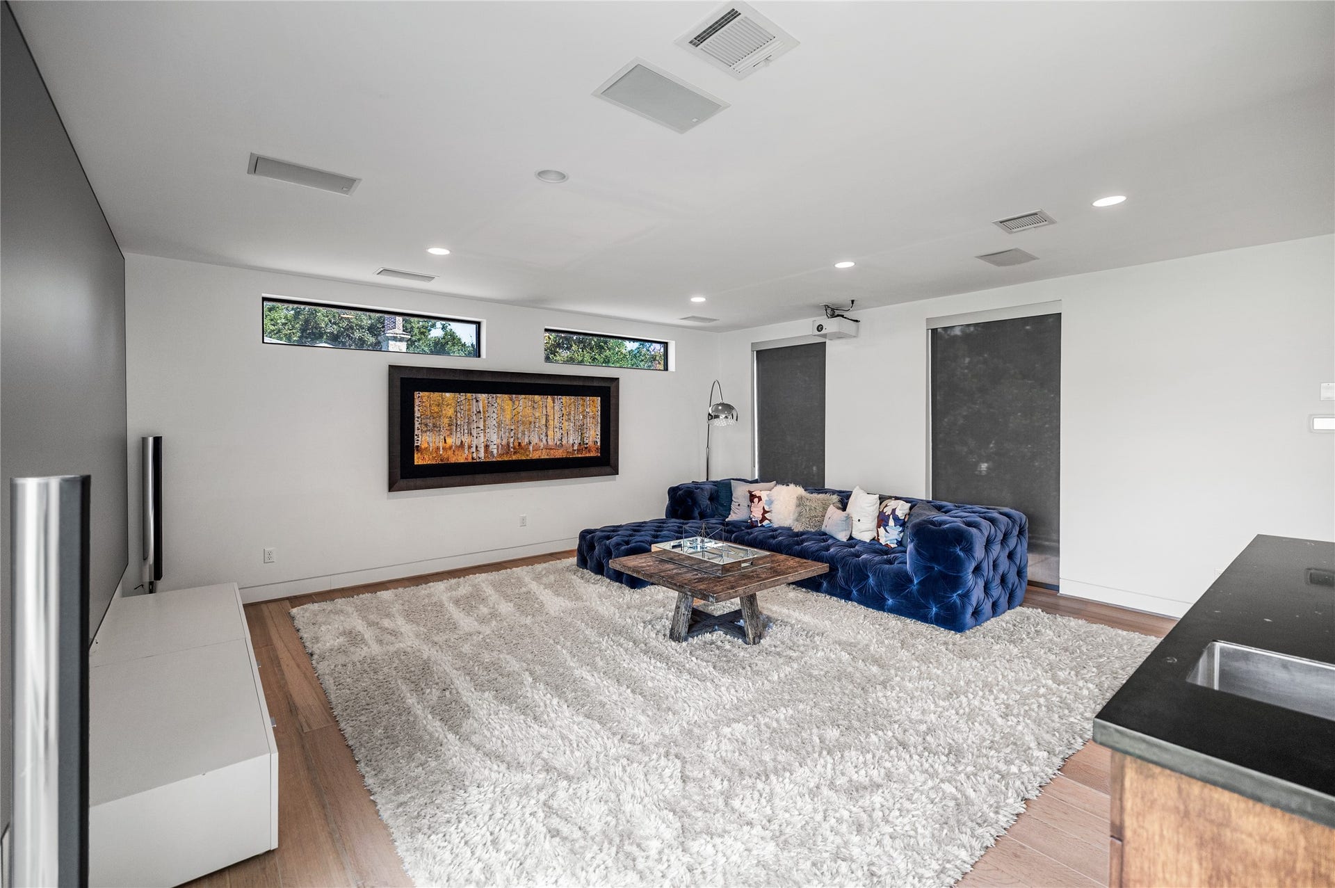2608 Barbara Lane, Houston, TX 77005 Spacious and serene, this media room is an inviting escape designed for effortless relaxation and immersive entertainment.