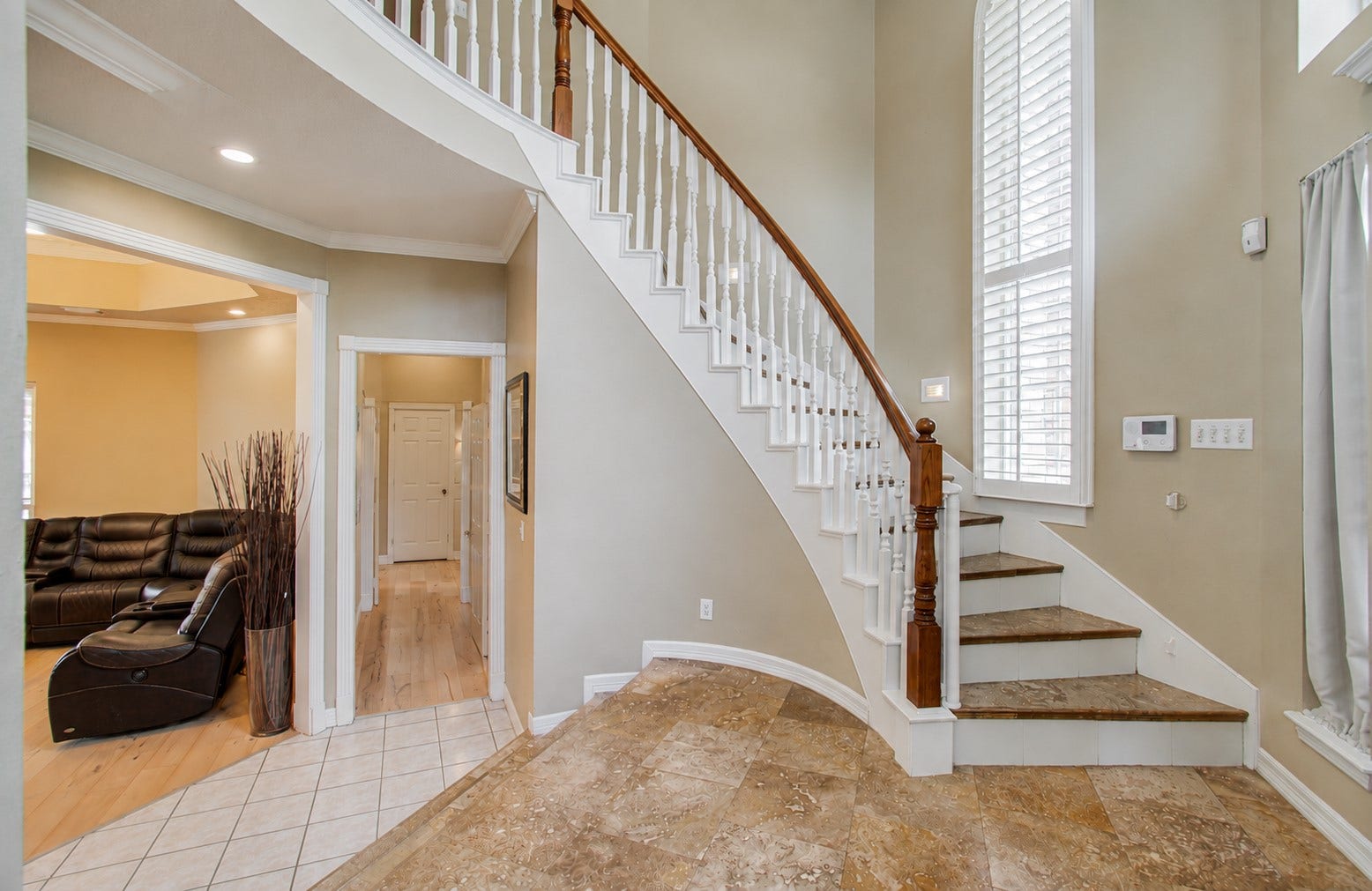 As you walk in you will be greeted with two story entry.  Hallway to the right is study and Primary room and to the left is the formal dining and family room/kitchen
