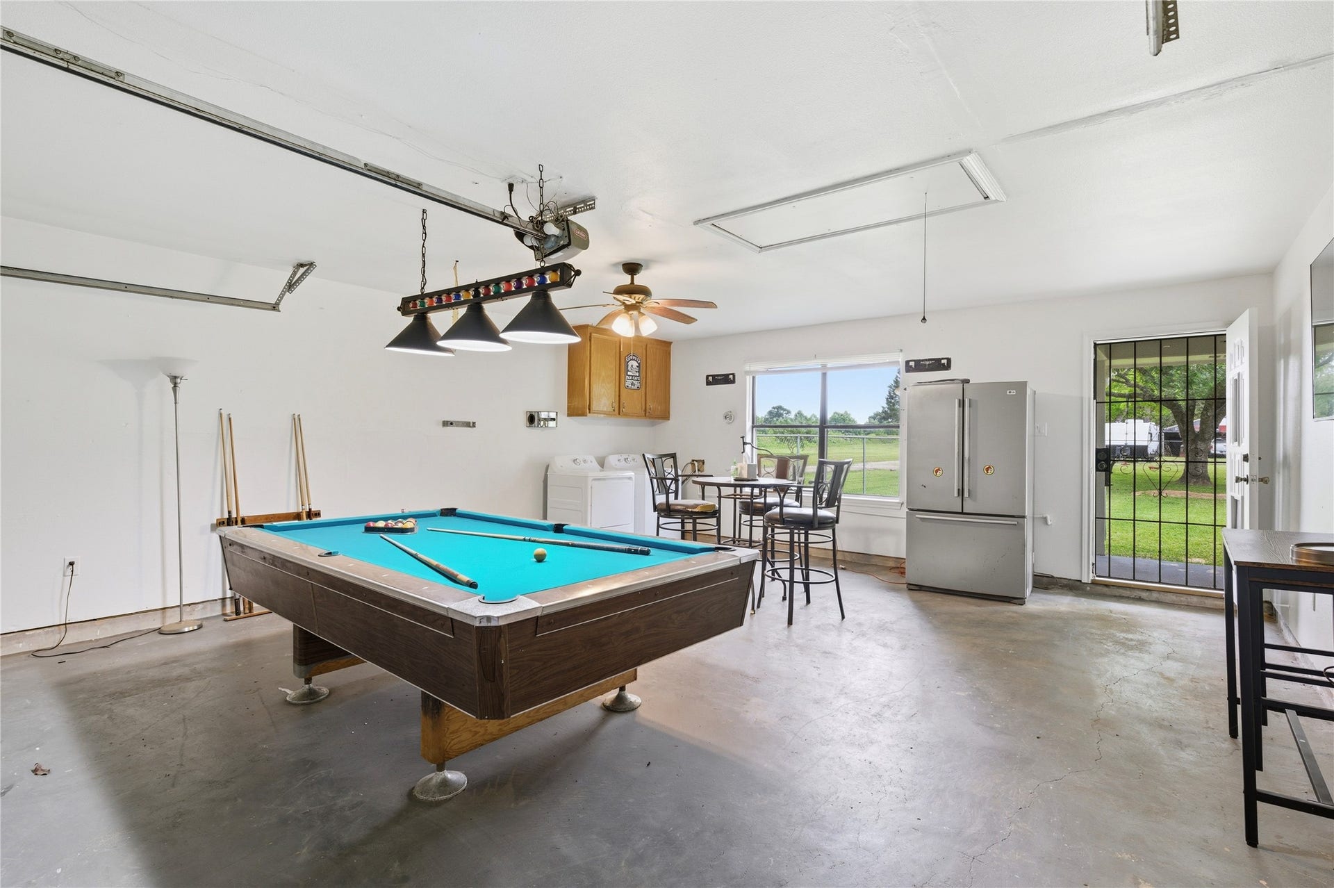 2517 Avenue L, Santa Fe, TX 77510 Garage turned into entertainment area.