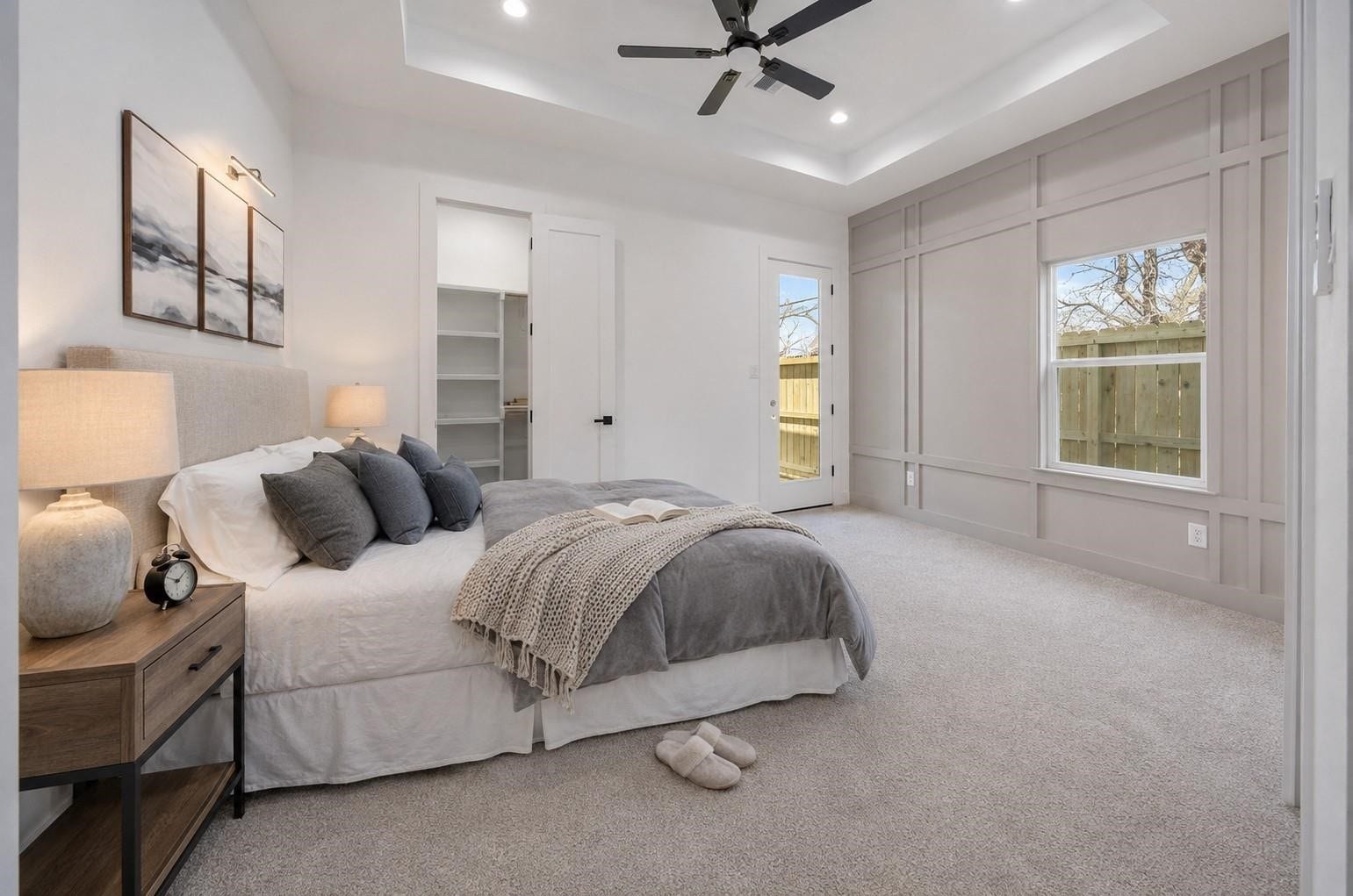 7920 Boy Street, #B, Houston, TX 77028 Another view of the primary bedroom highlighting its neutral finishes, ceiling fan, and natural lighting.