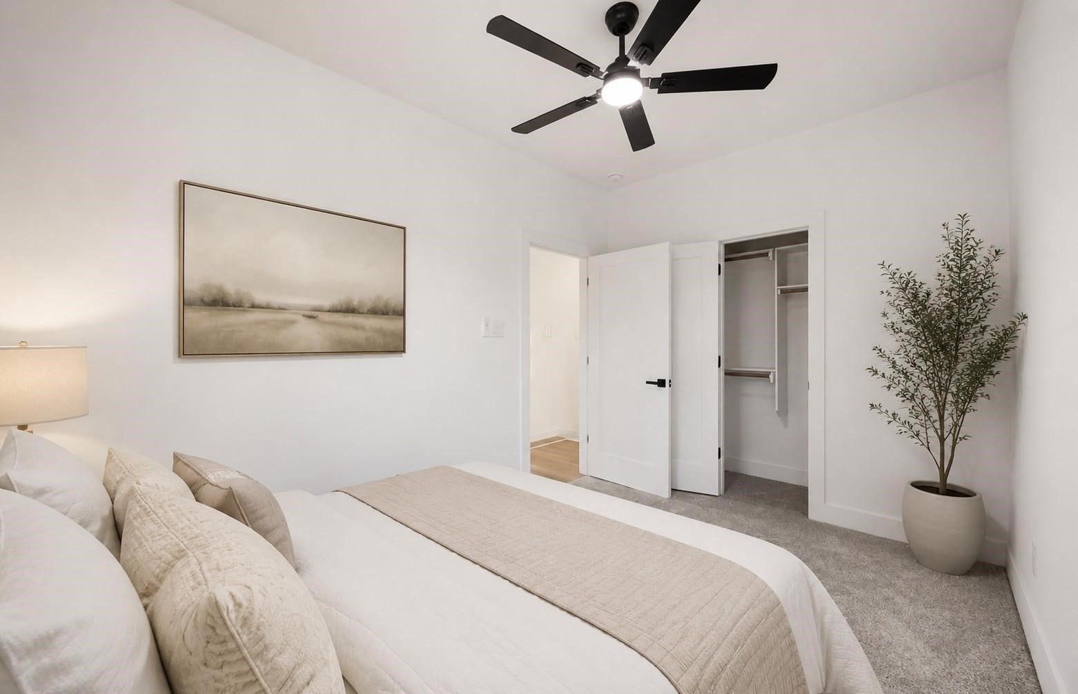 7920 Boy Street, #B, Houston, TX 77028 Comfortable bedroom featuring neutral tones, a ceiling fan, and a bright, welcoming atmosphere.
