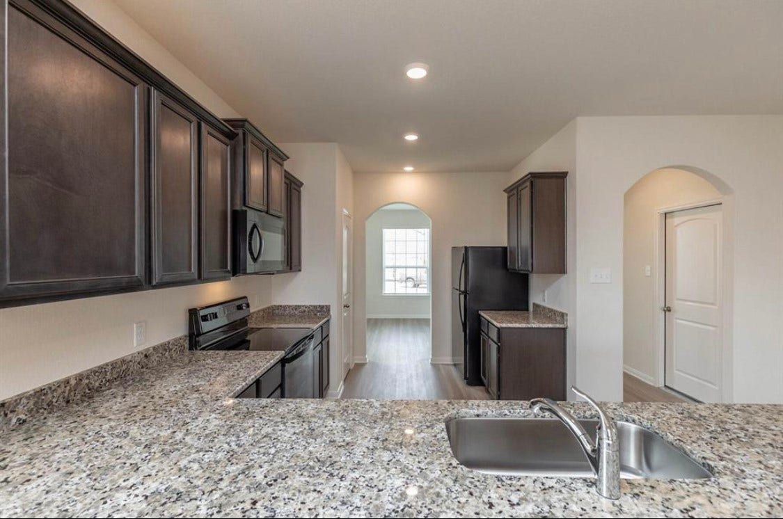 2136 Mule Ridge Drive, Katy, TX 77493 Kitchen with granite countertops.
