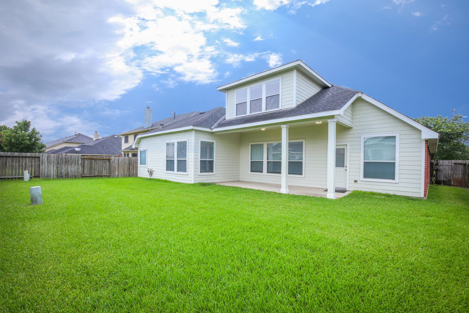 8802 Rocky Knoll Lane, Rosenberg, TX 77469 Spacious backyard with 23x11 covered porch to provide enough different backyard activities for you for pets..