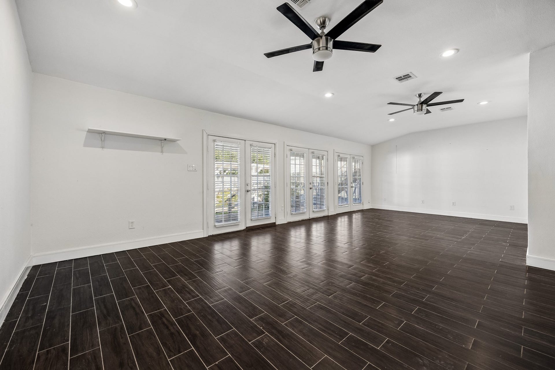 4431 N Roseneath Drive, Houston, TX 77021 Family room with double French doors to the backyard.