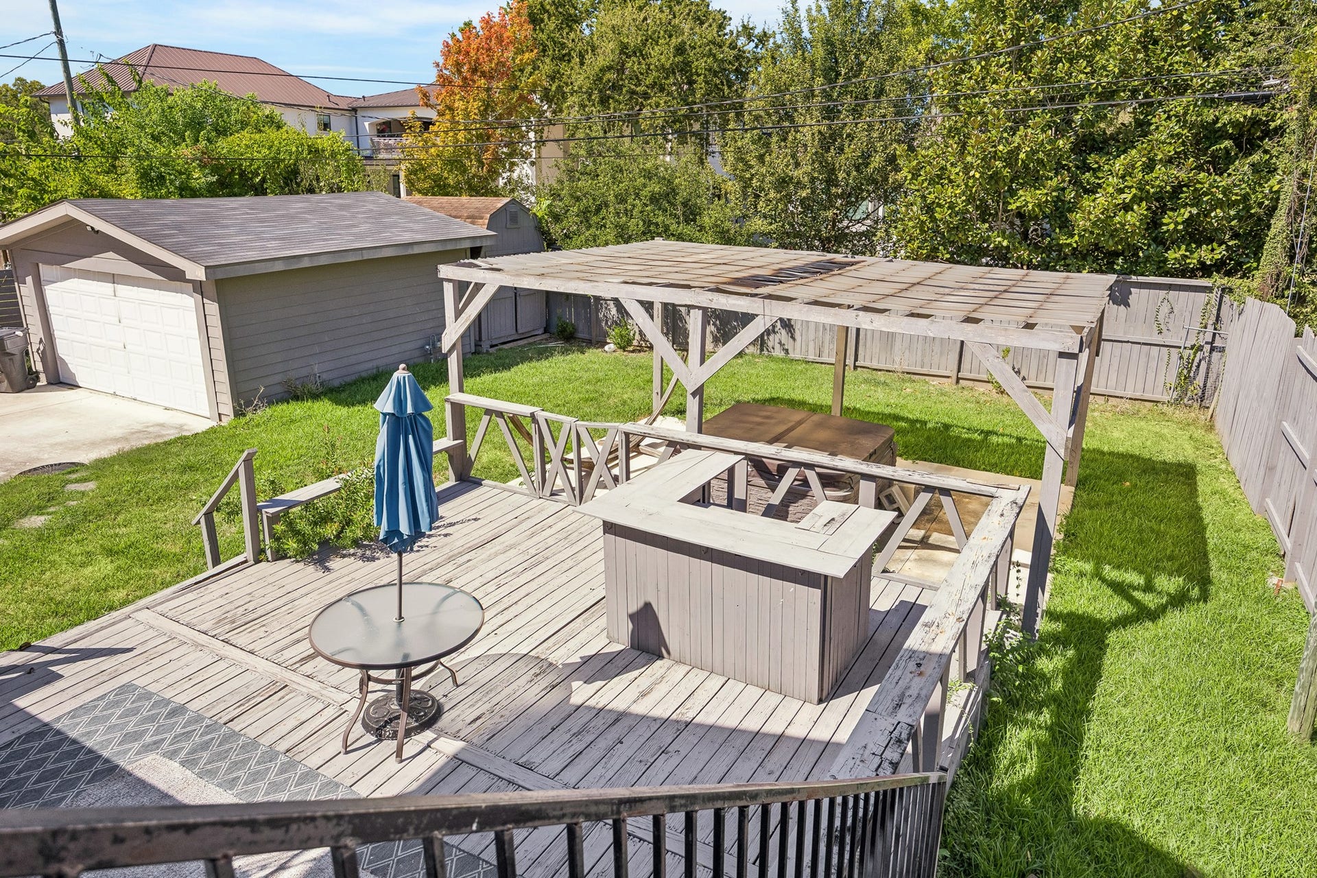 4431 N Roseneath Drive, Houston, TX 77021 Backyard deck with seating area and pergola.