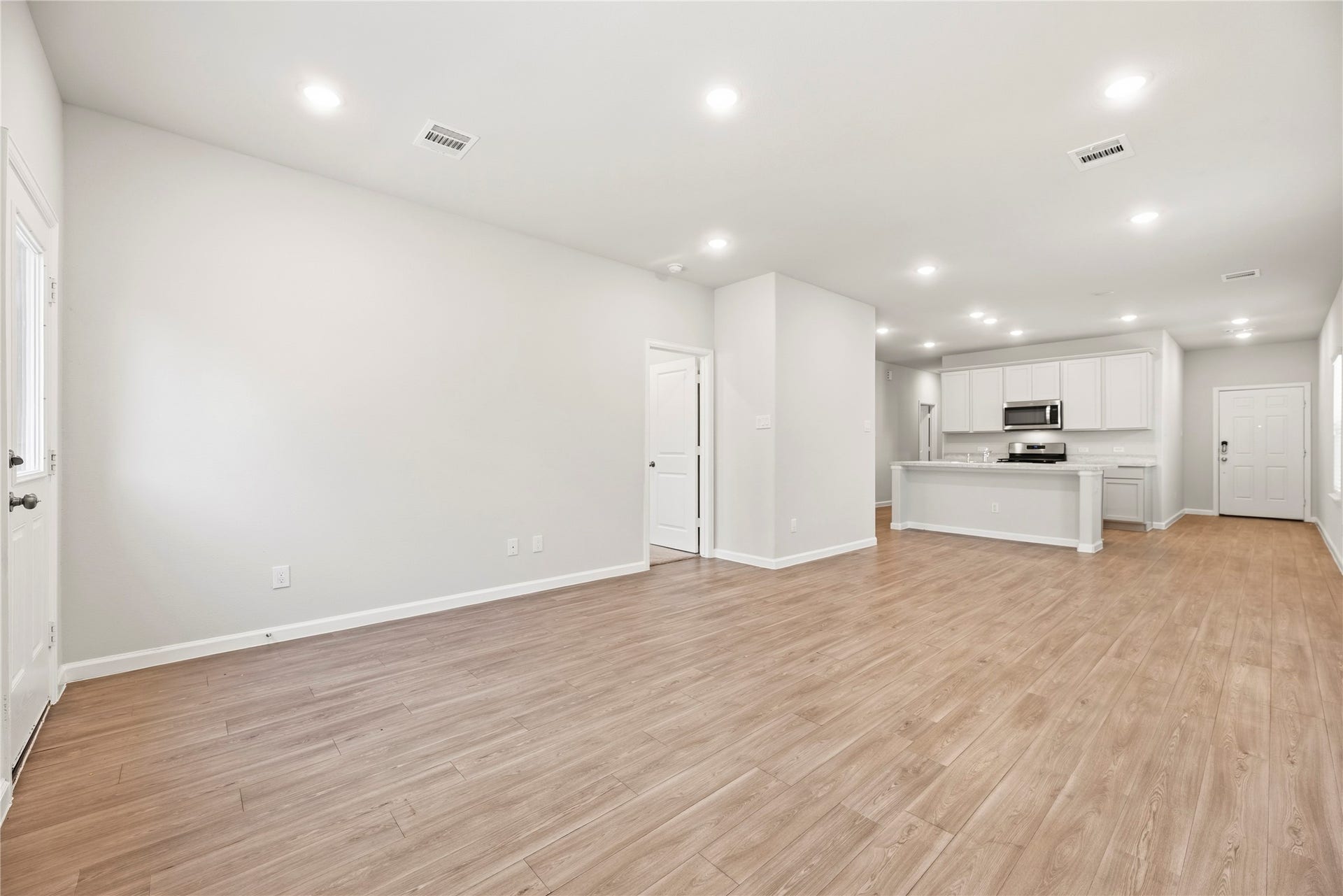 16493 Moss Lane, Porter, TX 77365 Enjoy a connected layout with room to arrange a comfortable seating area close to the kitchen. Recessed lighting and consistent flooring help the space feel cohesive.