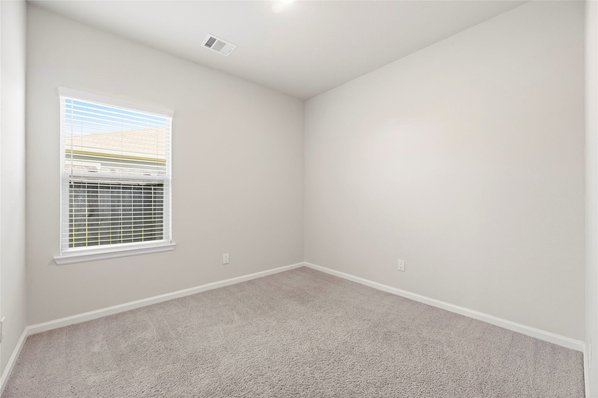 16493 Moss Lane, Porter, TX 77365 Create a comfortable sleeping space or a dedicated work-from-home setup in this additional room, finished with neutral walls and soft carpeting.