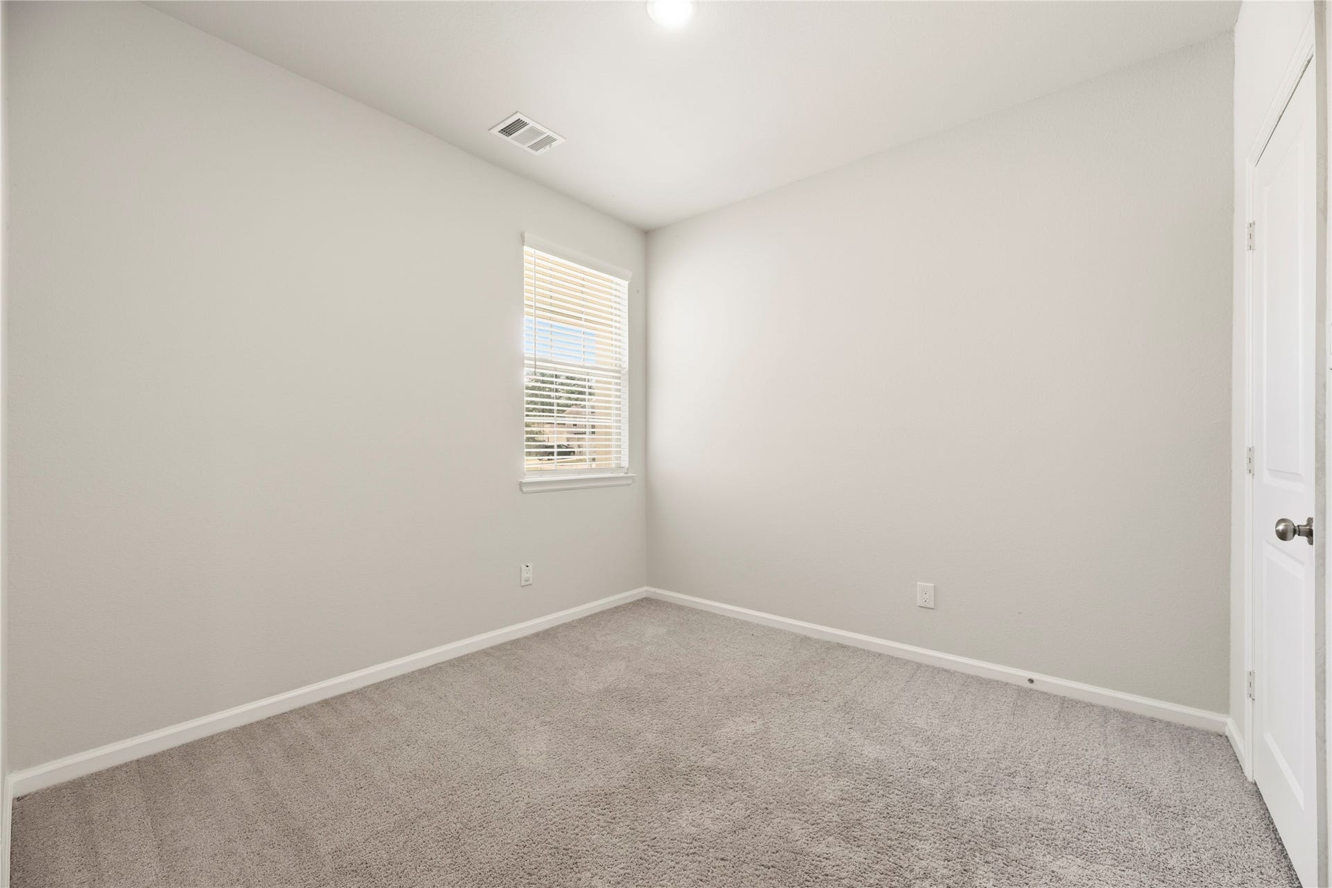 16493 Moss Lane, Porter, TX 77365 Another view highlights the rooms simple, adaptable layout, with closet doors and a window that make furniture placement easy to consider.
